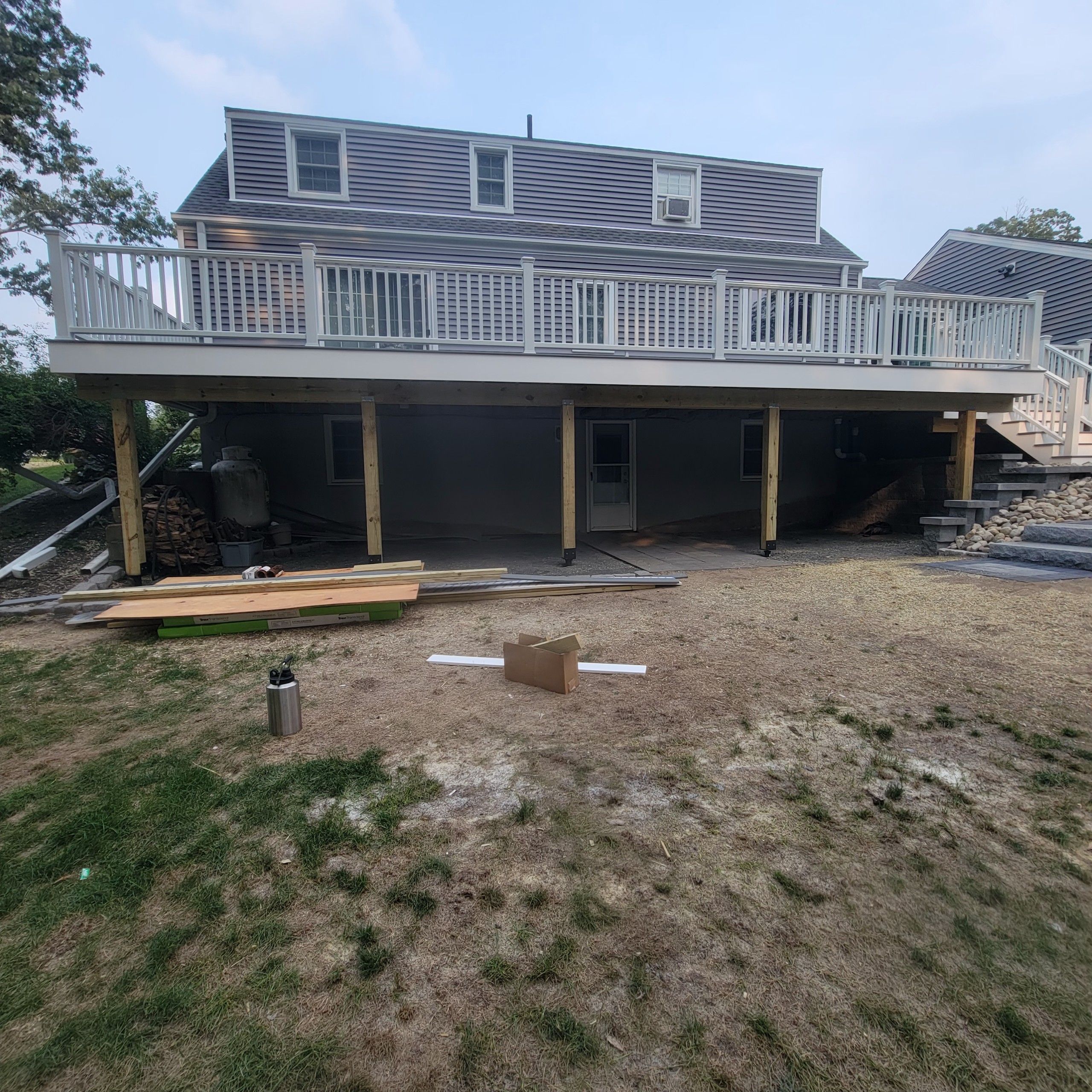 Deck replacement using Trex Select Pebble Gray and transcend White railing. by DiGiorgi Roofing and Siding Inc