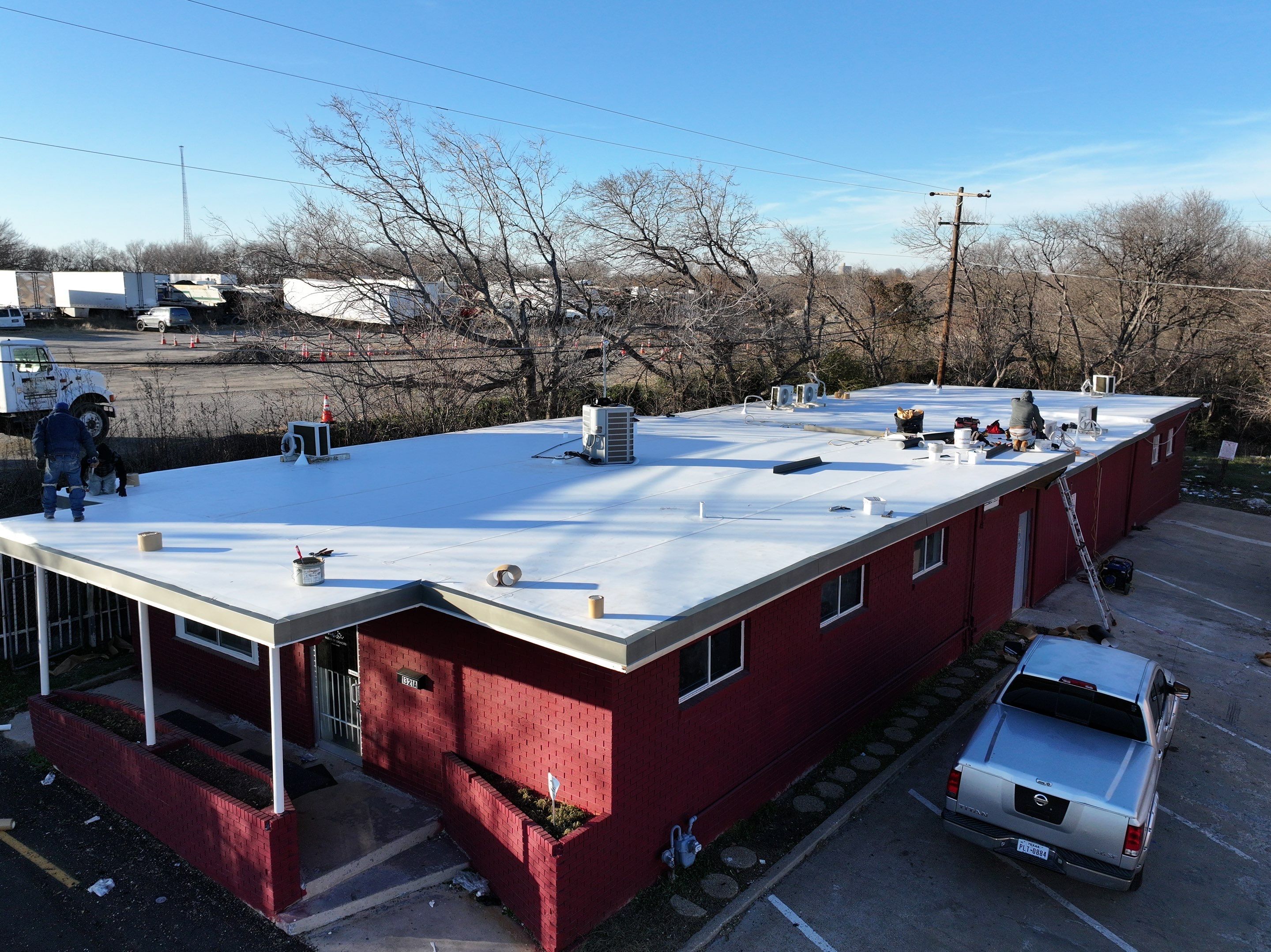 Commercial roofing overlay using GAF TPO over an old ballast roof by Becker Roofing and Exteriors