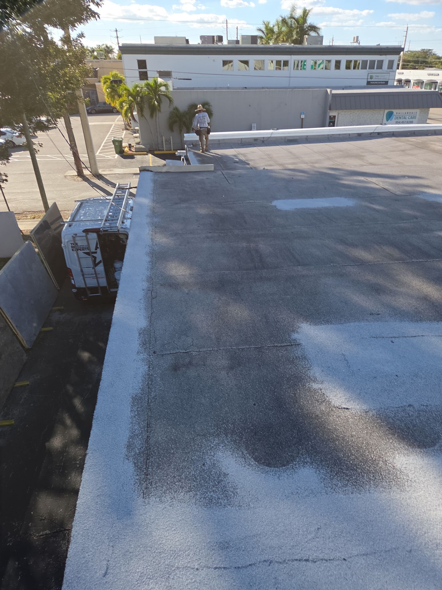 Commercial Flat Roof Restoration Using Silicone Coating in Hallandale Beach by Aastro Roofing
