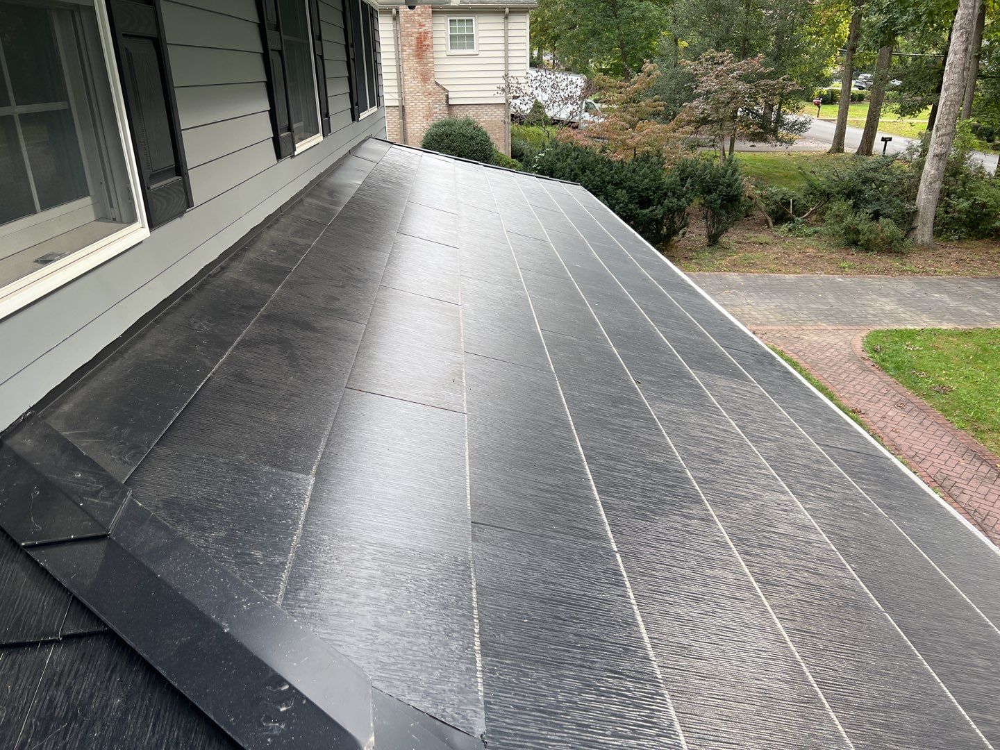 Tesla Solar Roof Replacement using Tesla Solar Roof V3 Tiles by American Home Contractors
