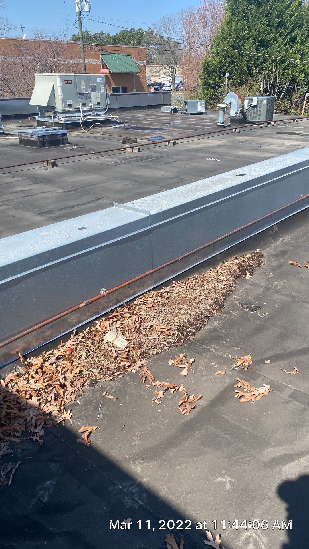Commercial Roof Coating using Fiberseal basecoat and Silicon Topcoat by Just In Time Roofing and Restoration