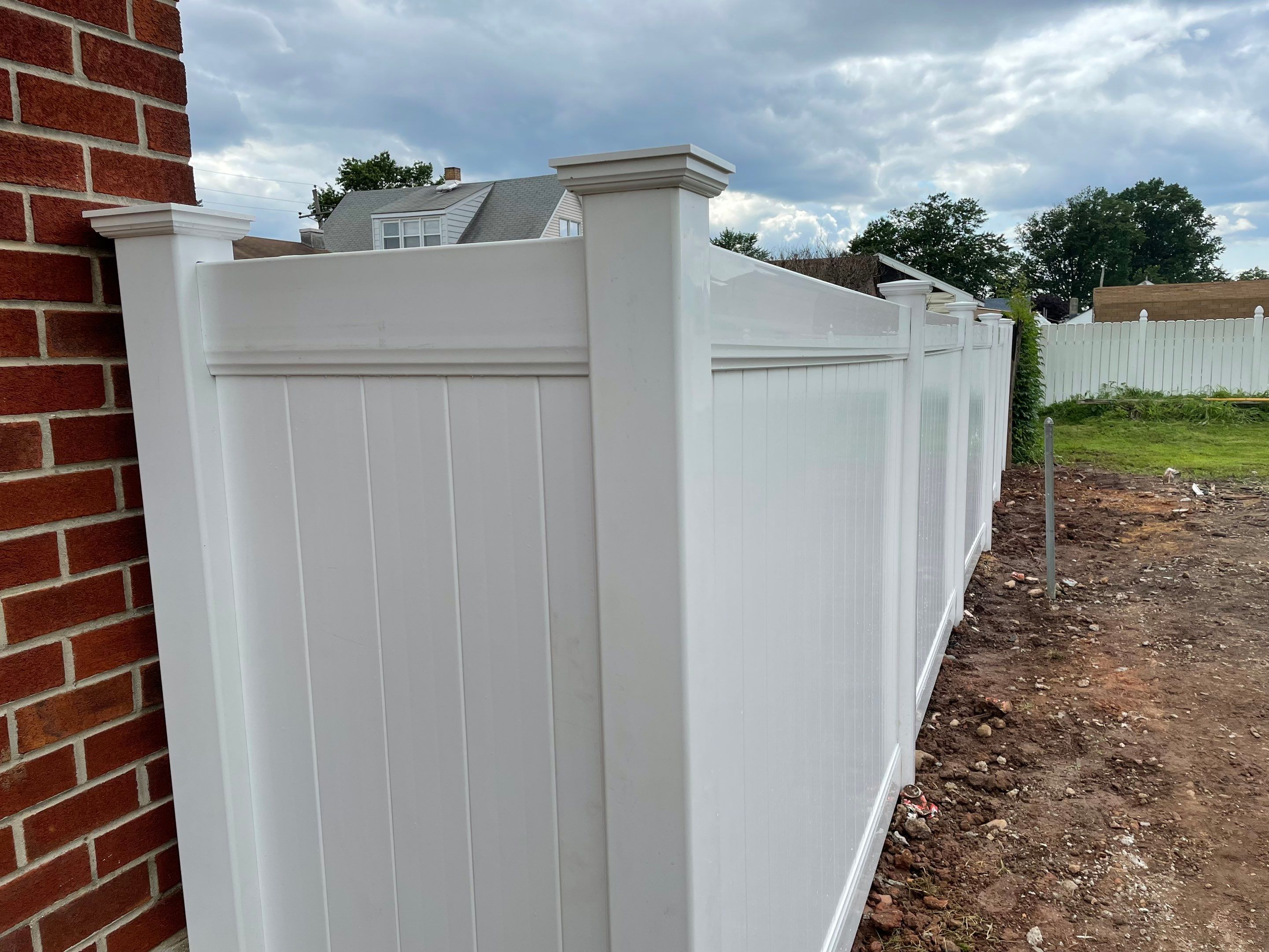 Fence Installation using White Fence by Home Concepts Construction