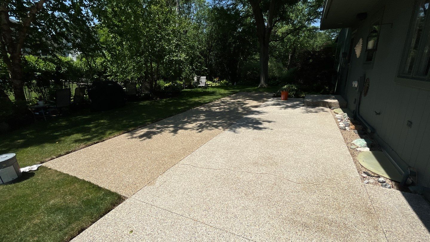 Aggregate concrete cleaning and sealing using Surebond SB-9000 by Northern Power Washing LLC.