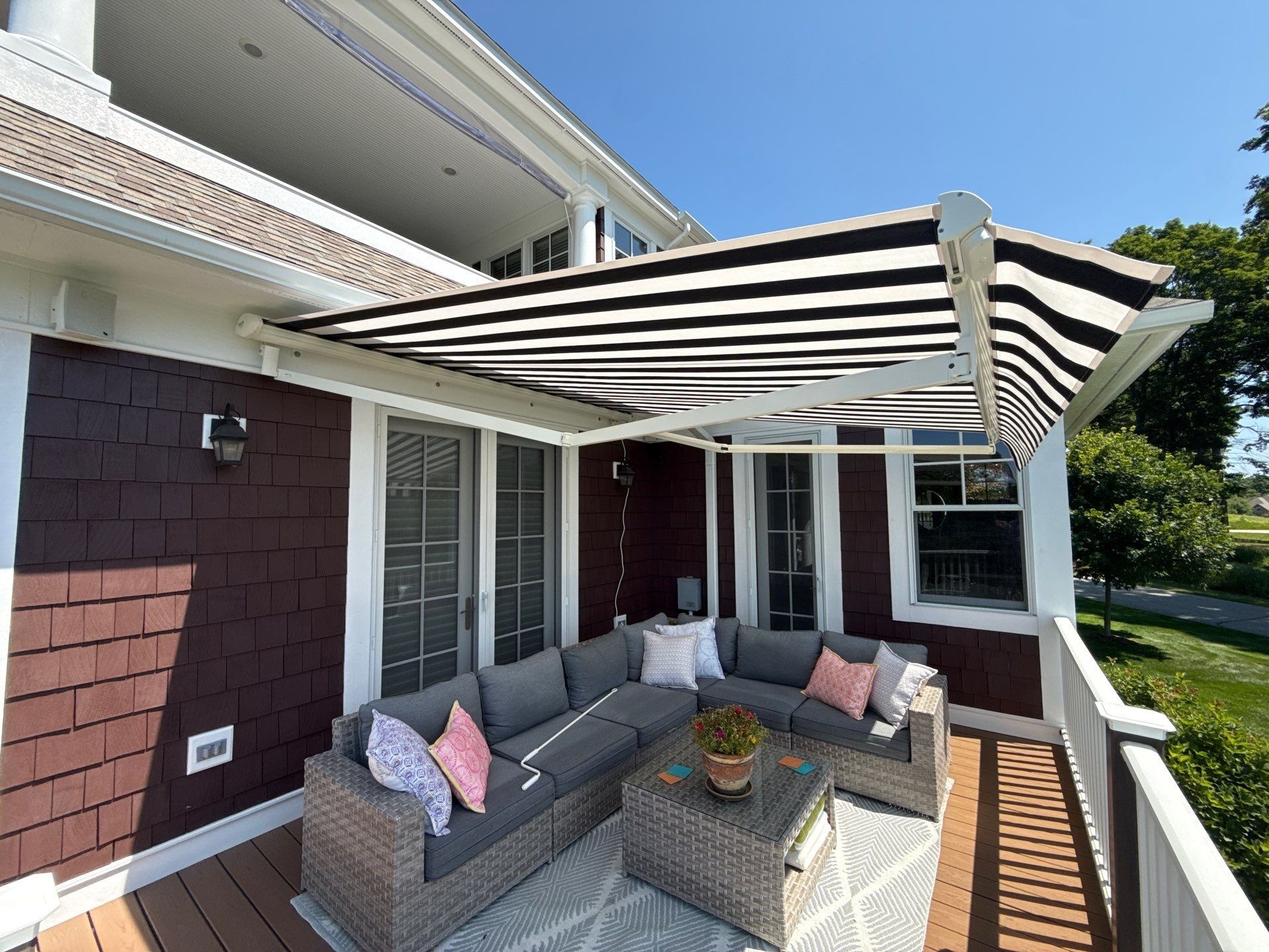 Sunesta Retractable Awning Installation in Harbor Springs by Rainbow Seamless Systems