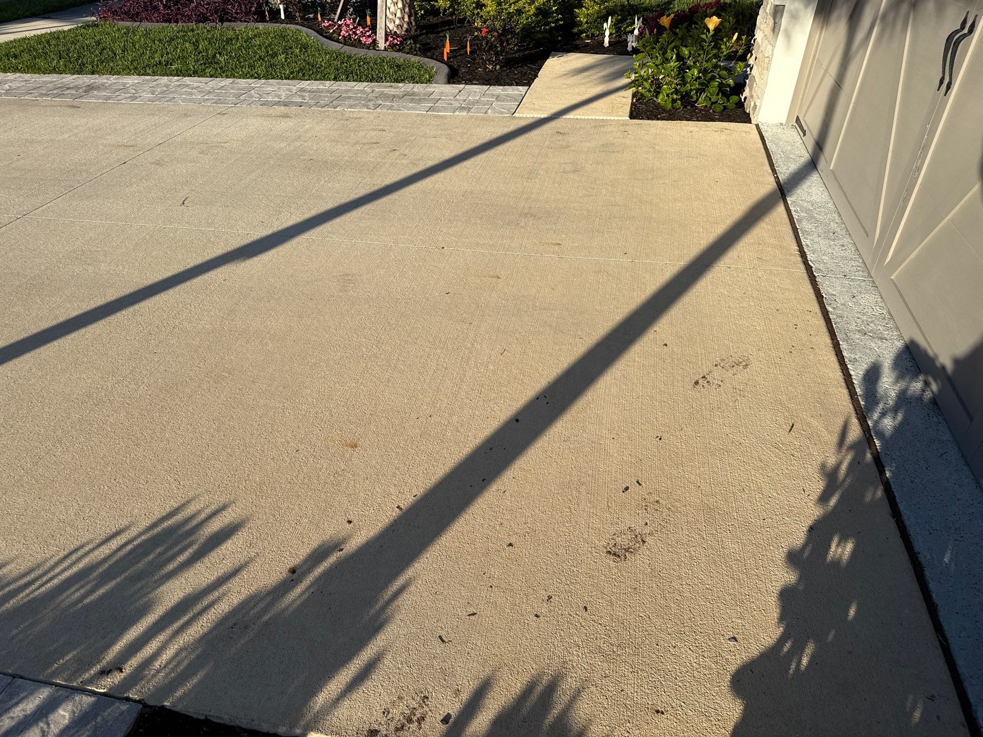 Rust Stain Removal from Concrete Driveway and Pavers in Park East at Azario | Lakewood Ranch, FL by Sunshine AquaWash