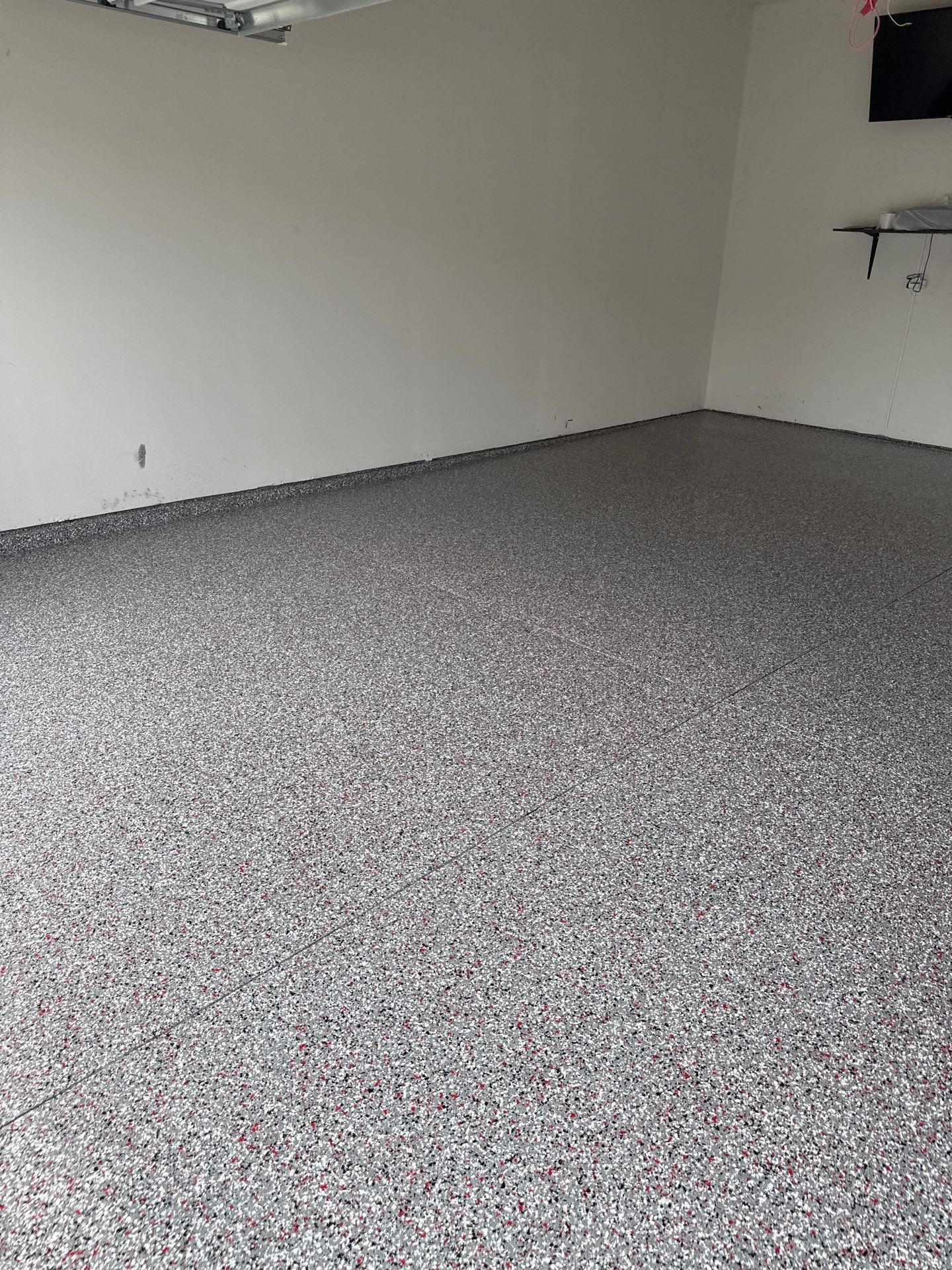 Custom Flake Garage Floor Coating Installation in Altoona by Revival Concrete Coatings