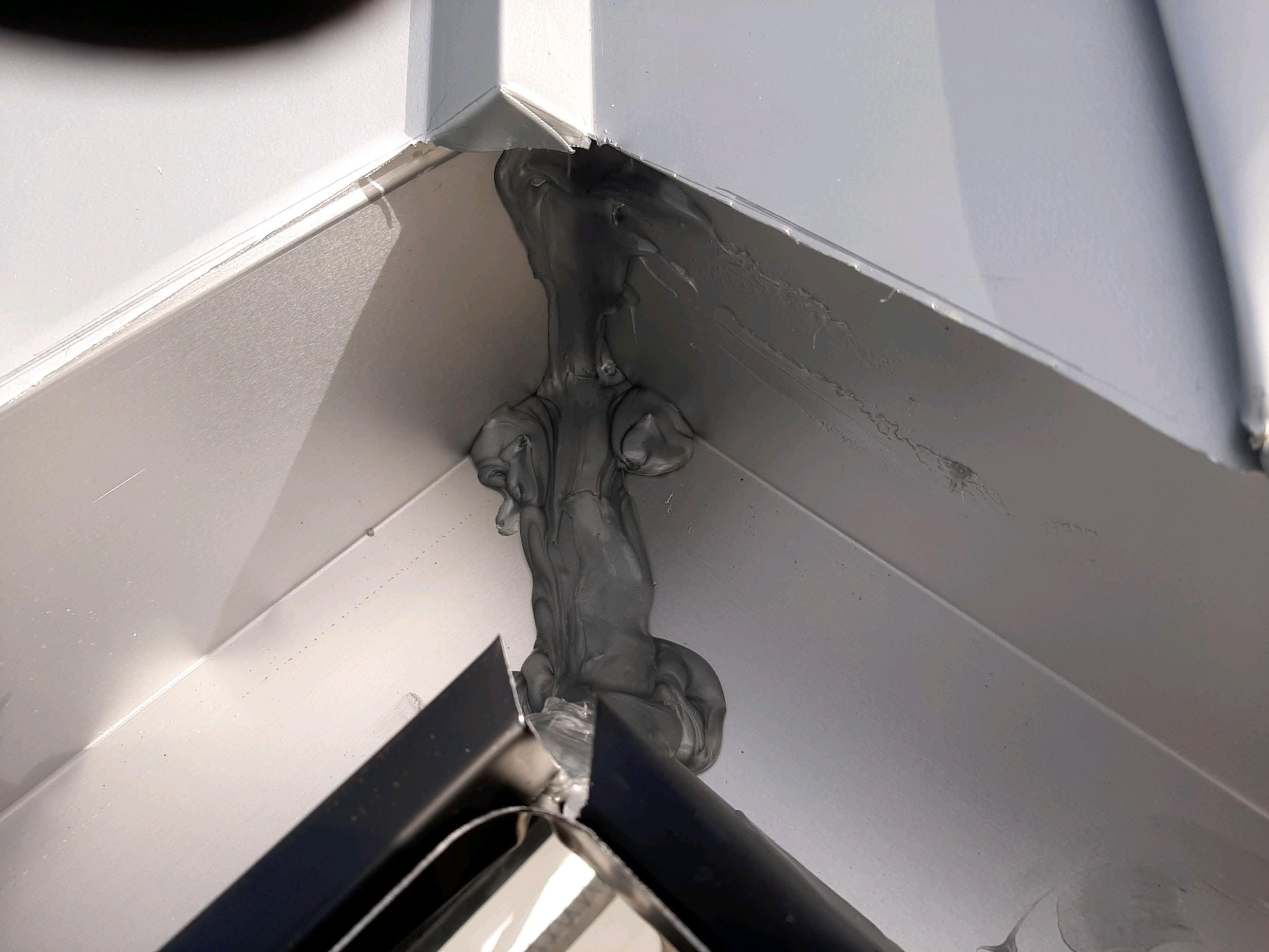 Seamless Gutter Installation Using Black Half Round Seamless Gutters by Gutter Professors
