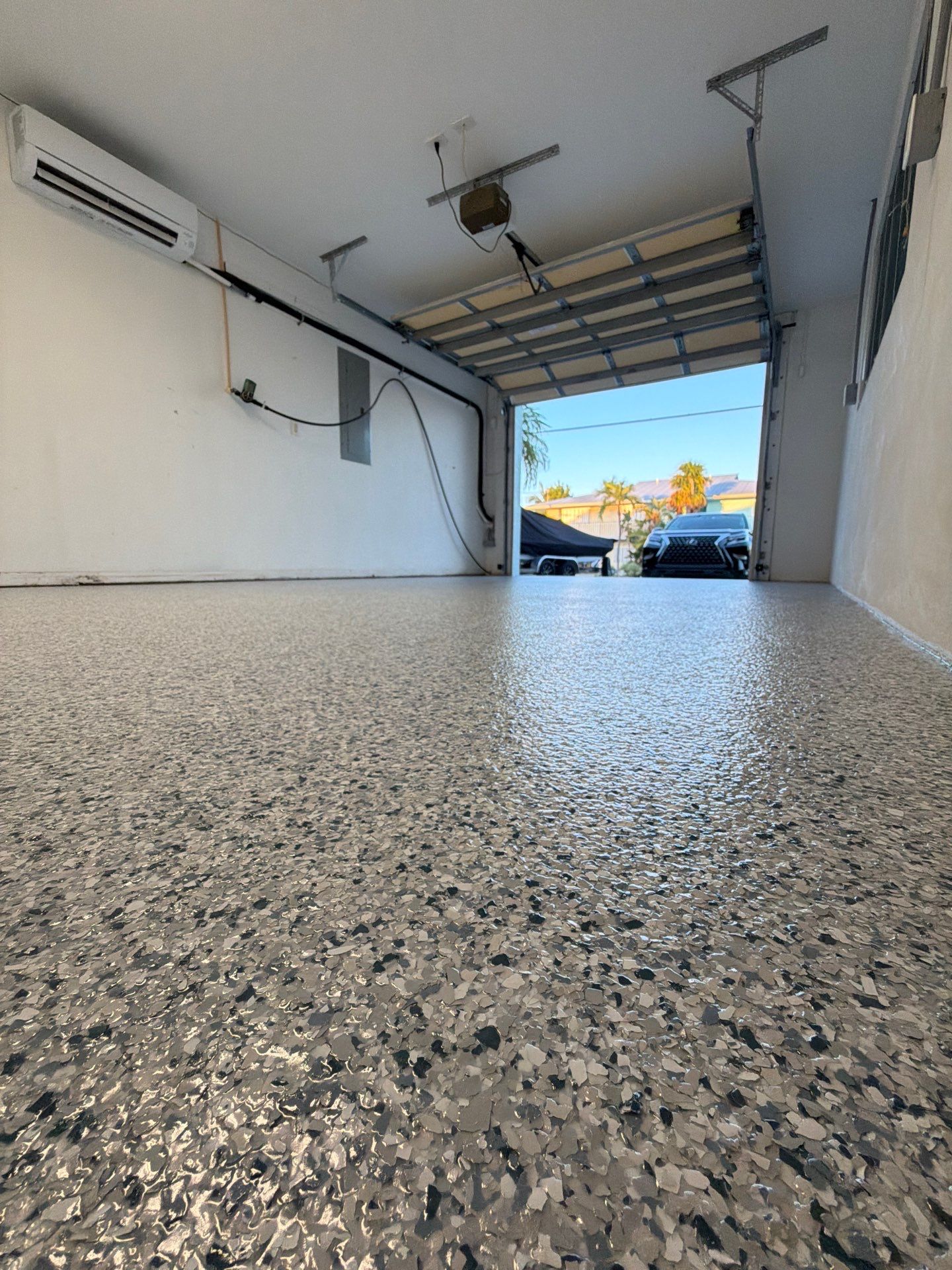 “Tidal Wave” Garage Floor in Key Colony Beach, FL by Tropical Epoxy Coatings & Creations LLC 