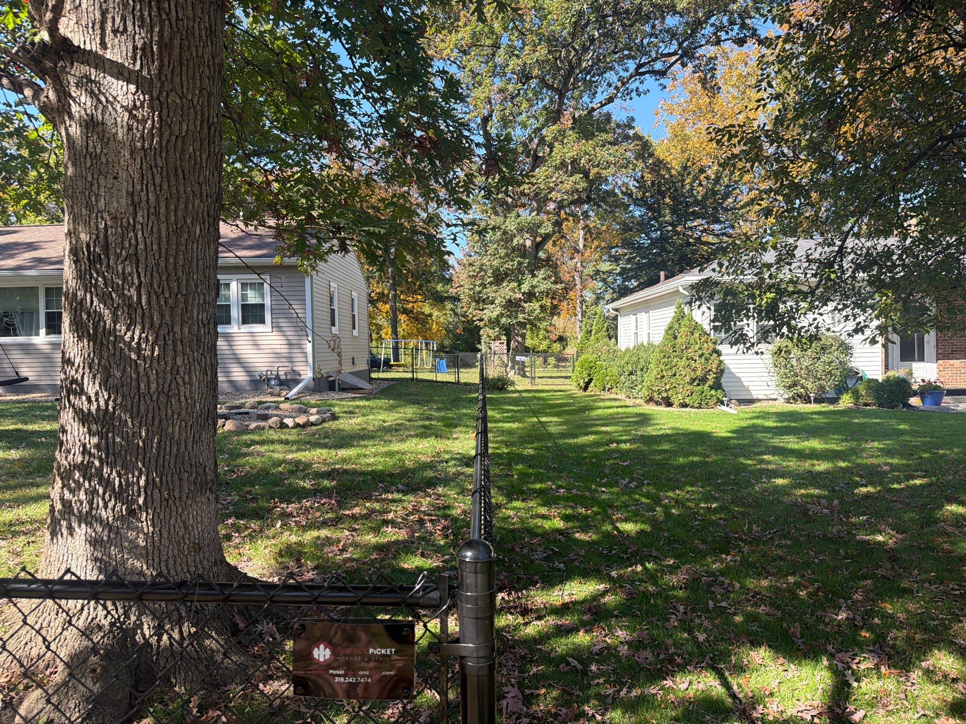 Residential Black Chain Link Fencing in Cedar Falls by Perfect Picket Fence and Stain
