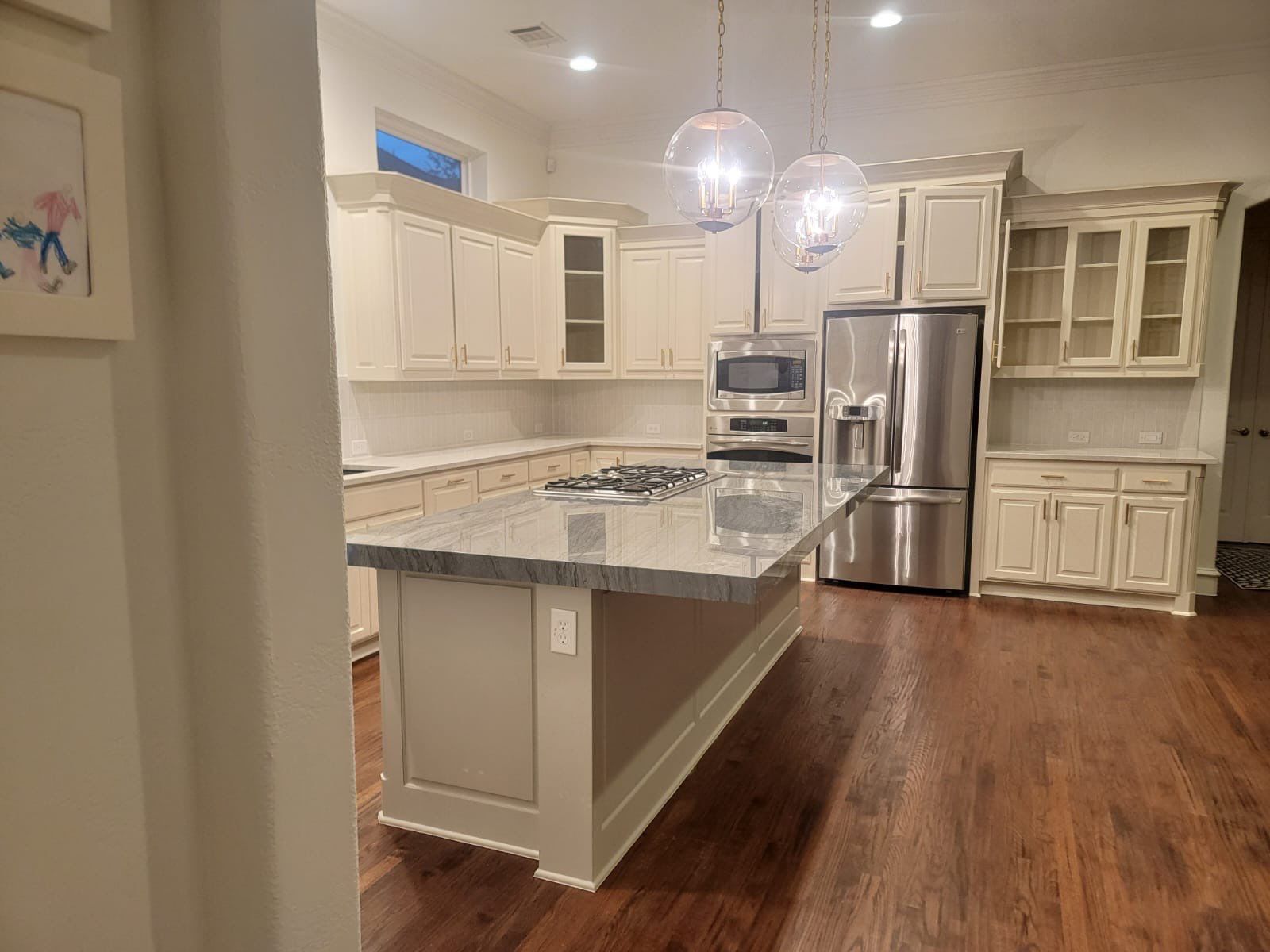 Kitchen Remodel using Quartzite by SLM General Contractors & Roofing