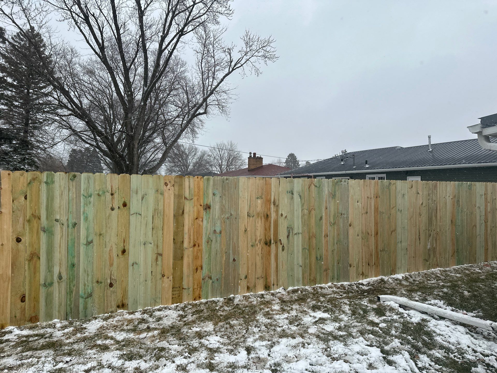 Pressure-Treated Wood Privacy Fence Replacement in Waterloo by Perfect Picket Fence and Stain