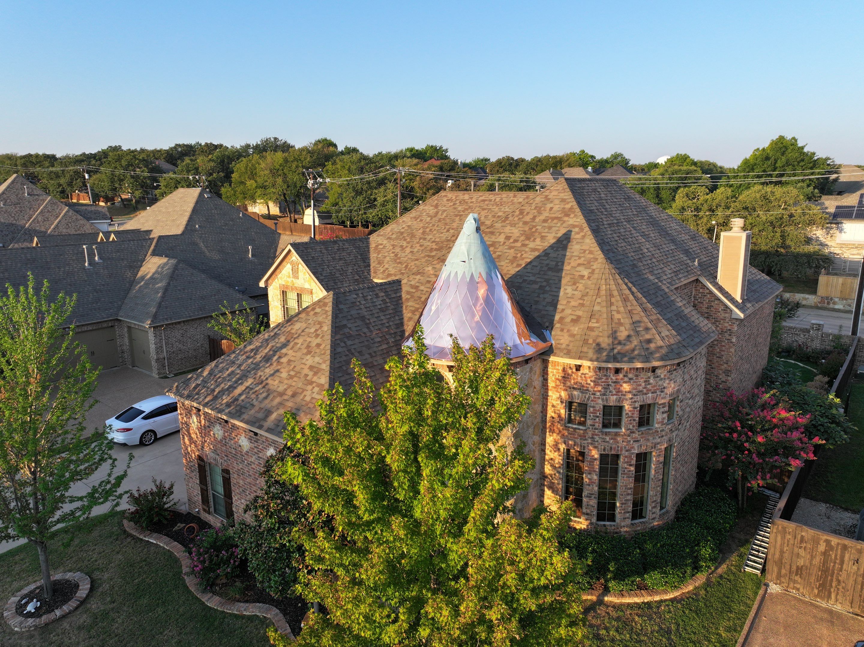 Installing Custom copper turret and Malarkey Vista Class 4 shingles Hail Damage Upgrade by Becker Roofing and Exteriors