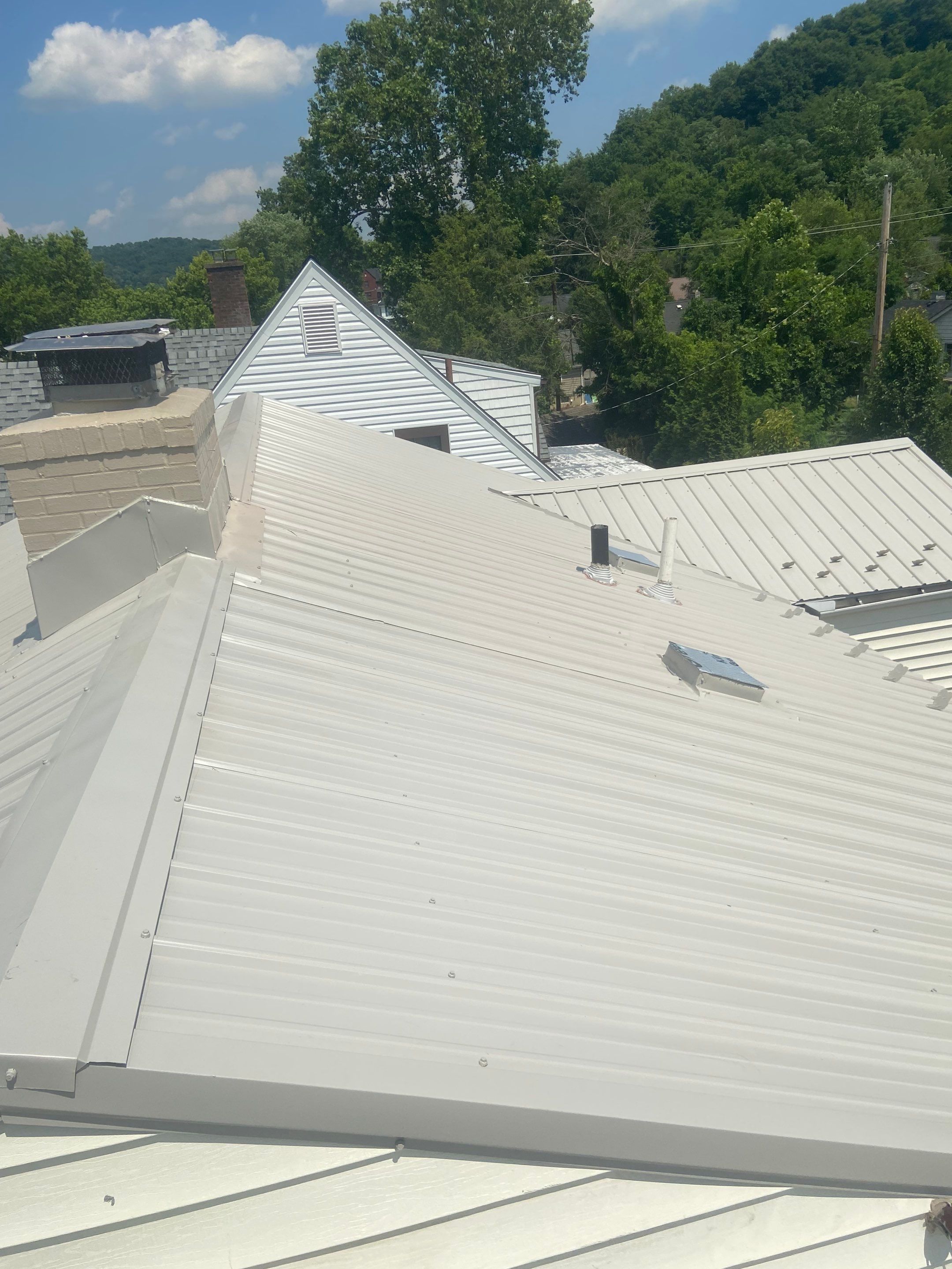 Metal Roofing, Skylights, Porch Build by Secure Construction Company Inc