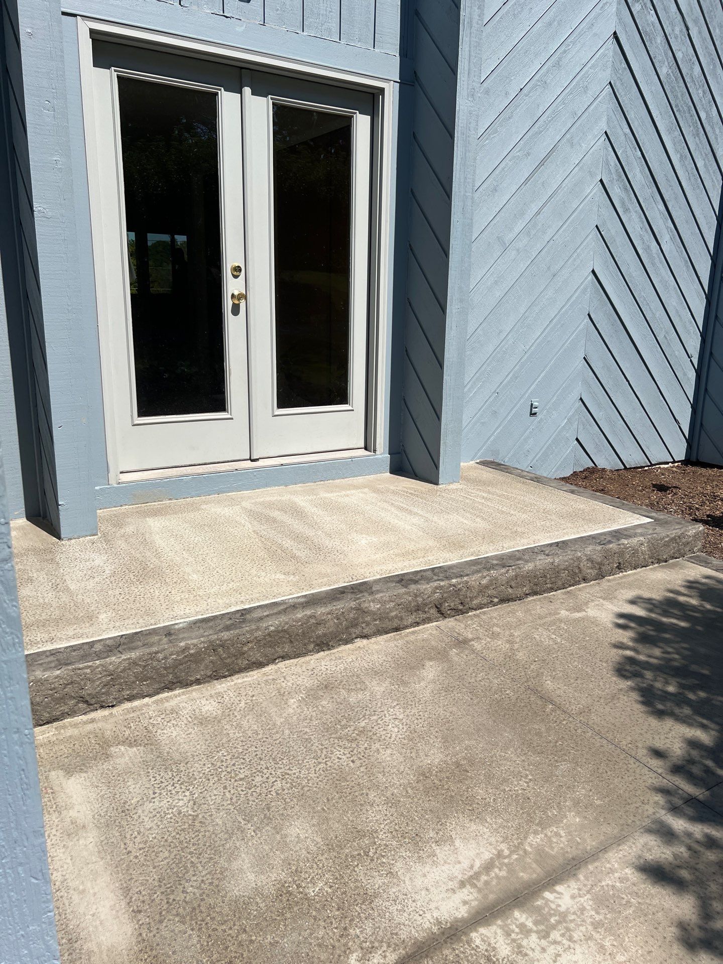 Charcoal Release Border with Broom Finish  by NG Masonry & Construction LLC