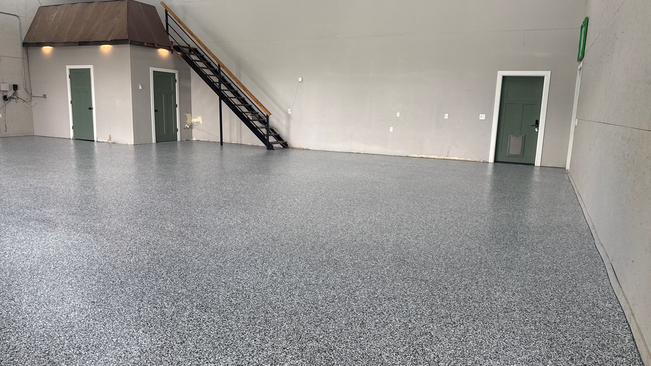 Domino Flake Floor Coating in De Soto by Banner Garage