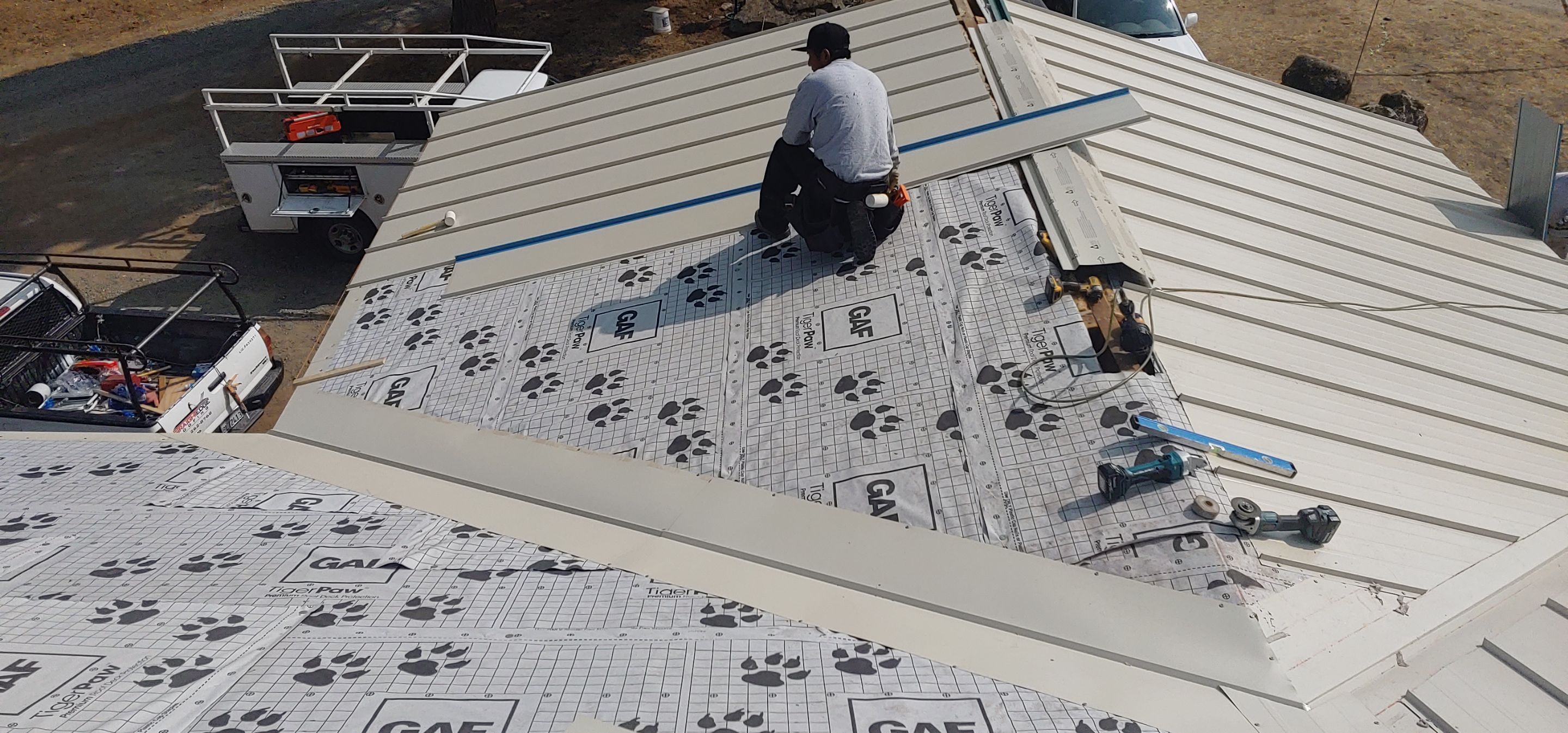 Residential Roofing Installation using Standing seam metal roofing system by Straight Edge Roofing Inc