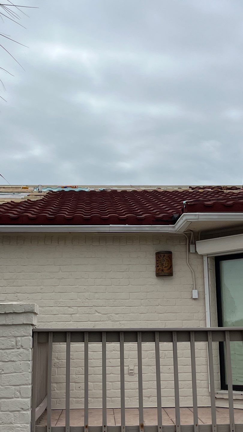 Off with the Tile and on with the TILCOR stone coated metal.  by Bayfront Roofing and Construction