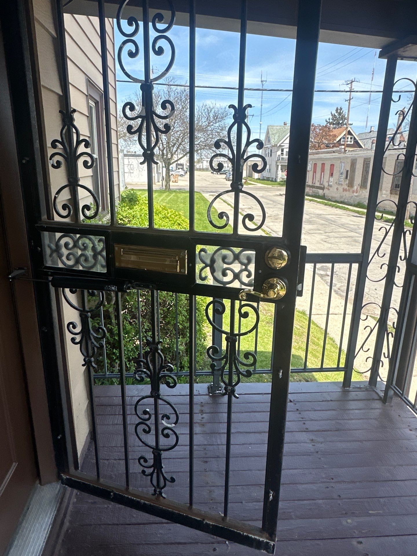 Milwaukee Exterior Porch Refinishing and Security Door Installation by OCS Contracting Services