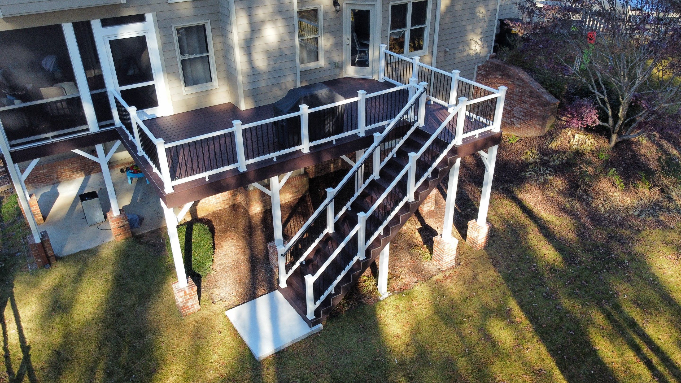Multi-Level Composite Deck and Screened Porch in Acworth by Swift Home Renovations 