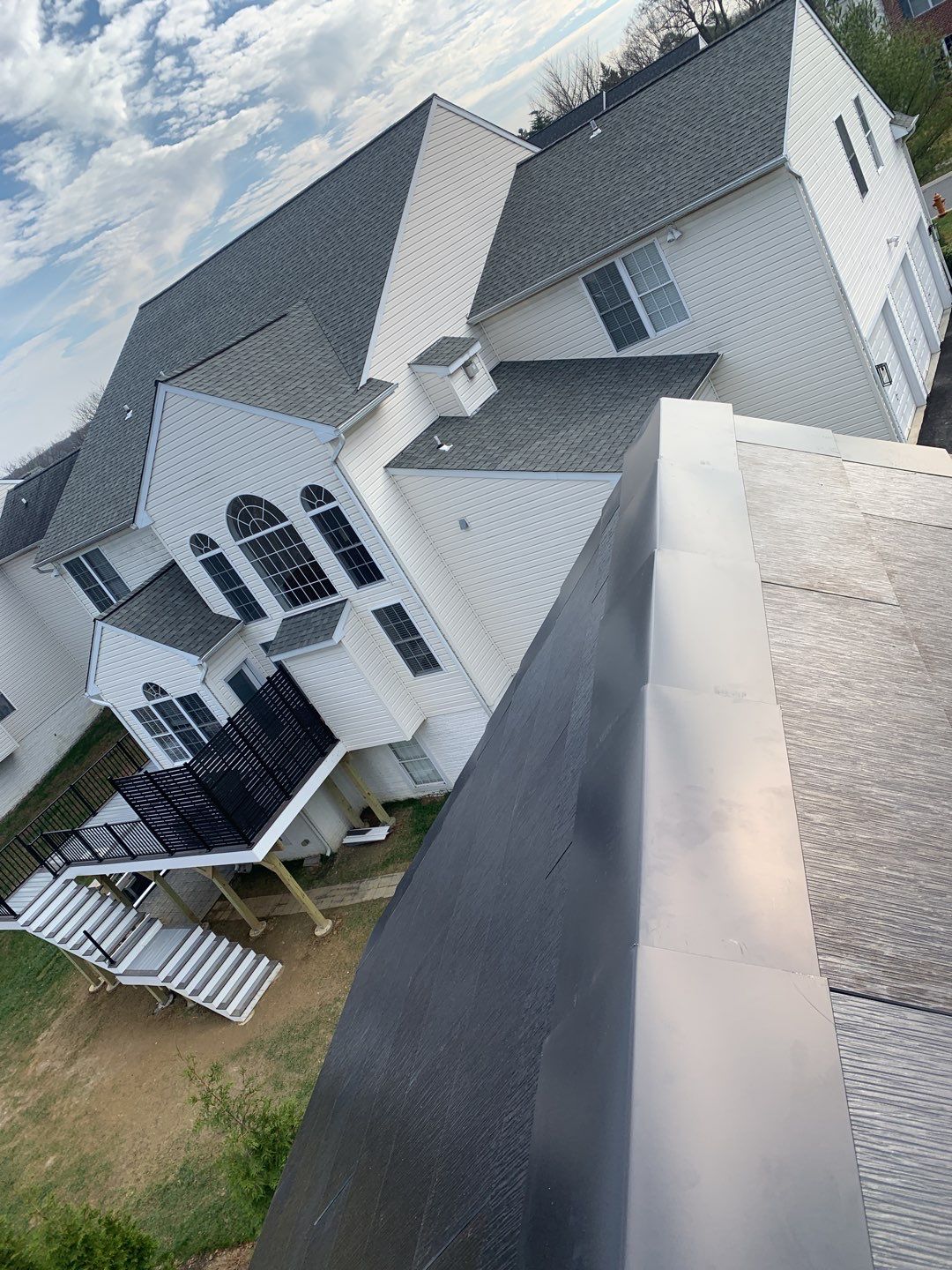 Tesla Solar Roof and Gutter Installation by American Home Contractors