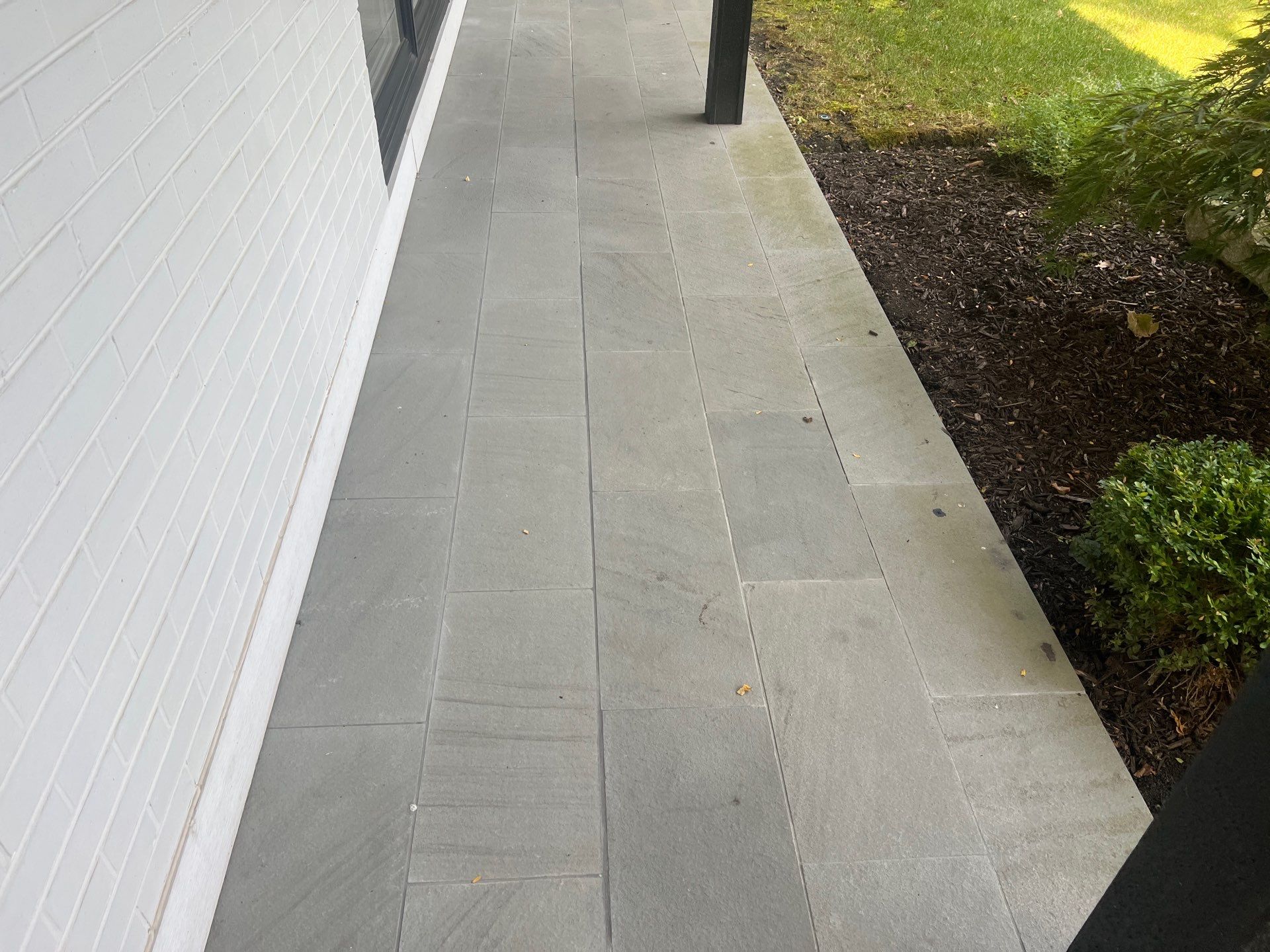 Complete Exterior House, Bluestone & Garage Floor Cleaning by Northern Power Washing LLC.