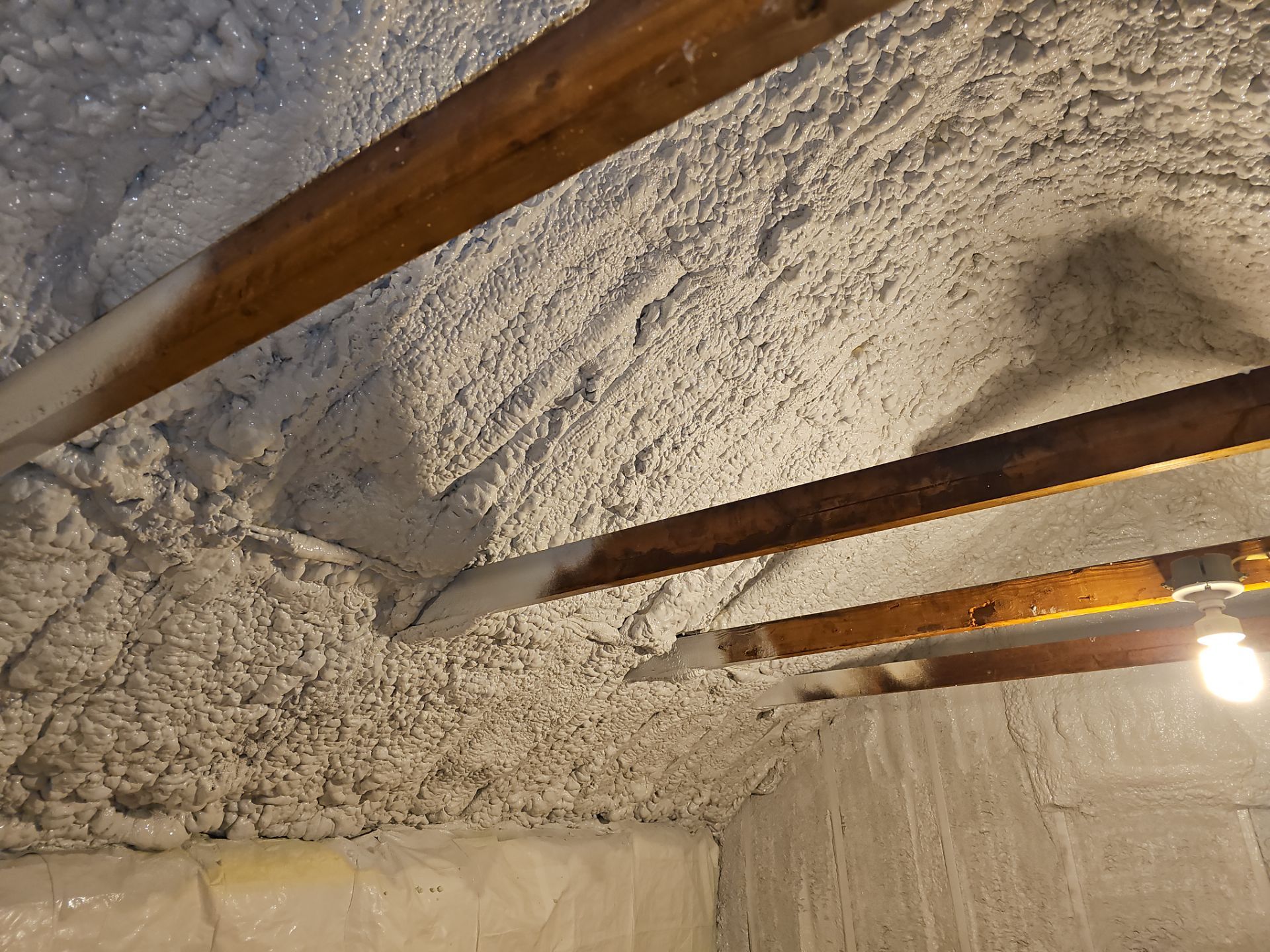 Attic Retrofit using open cell spray foam by NYS Foam & Energy