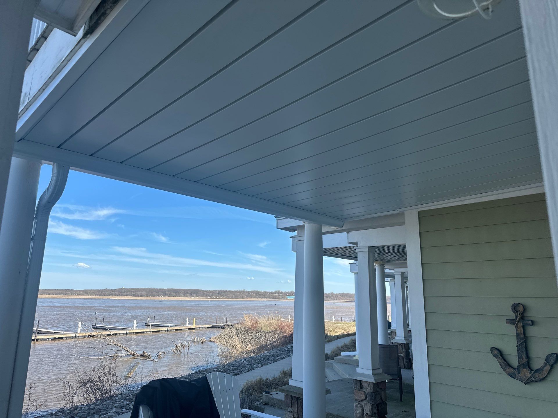 Waterfront Underdeck System Installation and Covered Patio in Manistee by Rainbow Seamless Systems