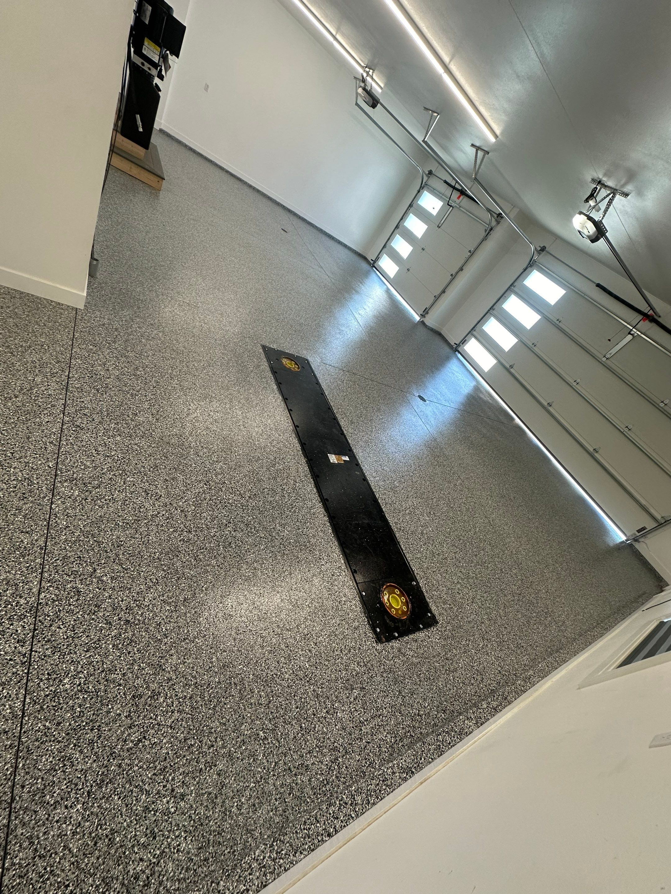 Multi-Color Epoxy Flake Garage Floor Installation in Sioux Falls by Select Painting, Coatings & Garage Cabinets