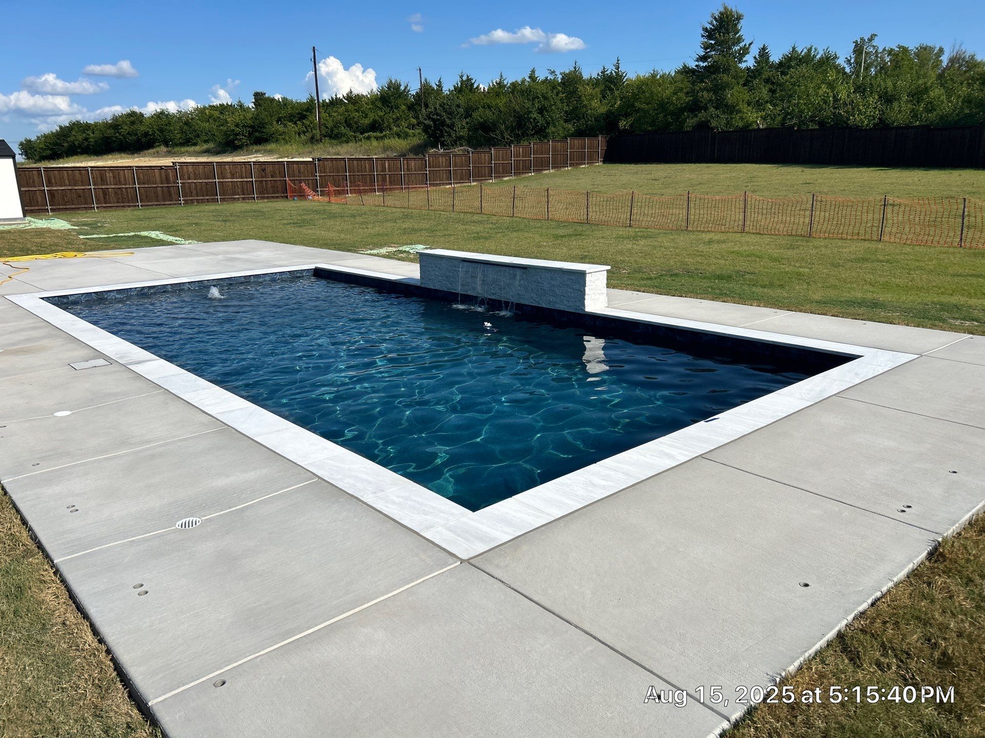 Modern Geometric Pool with Raised Wall Feature by Pinnacle Pools and Spas - DFW