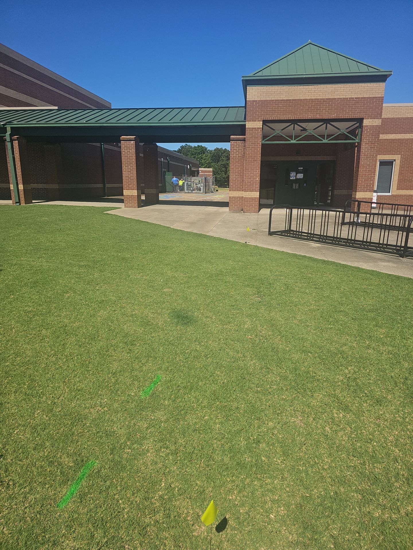 Utility Locating at a school for fence install by Alsip Locating Service, LLC