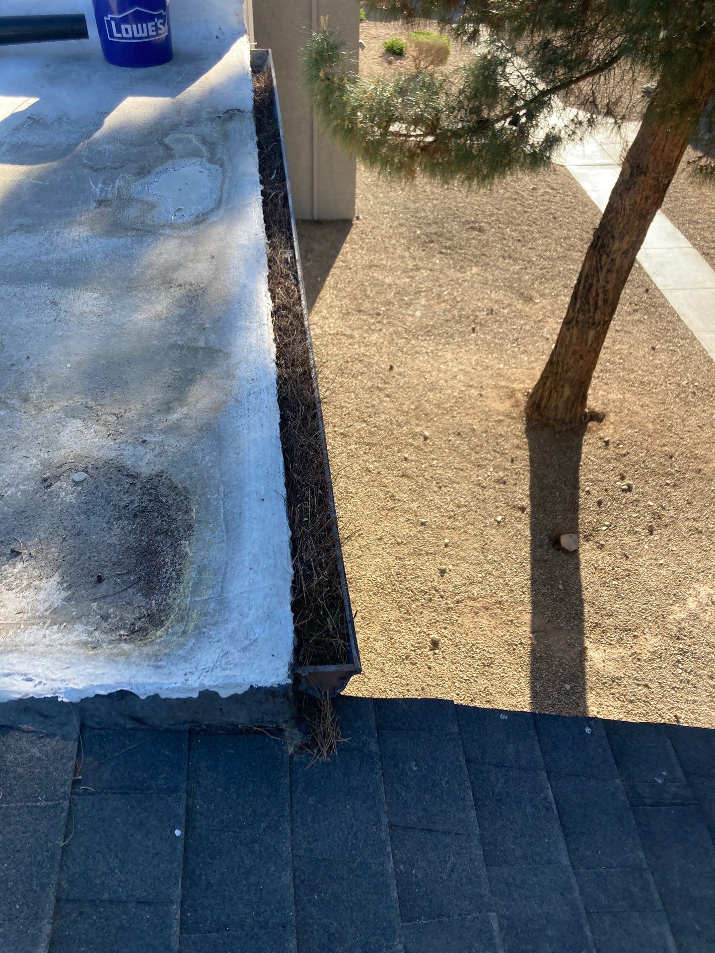 Commercial gutter cleaning Las Vegas before photo with filled gutters
