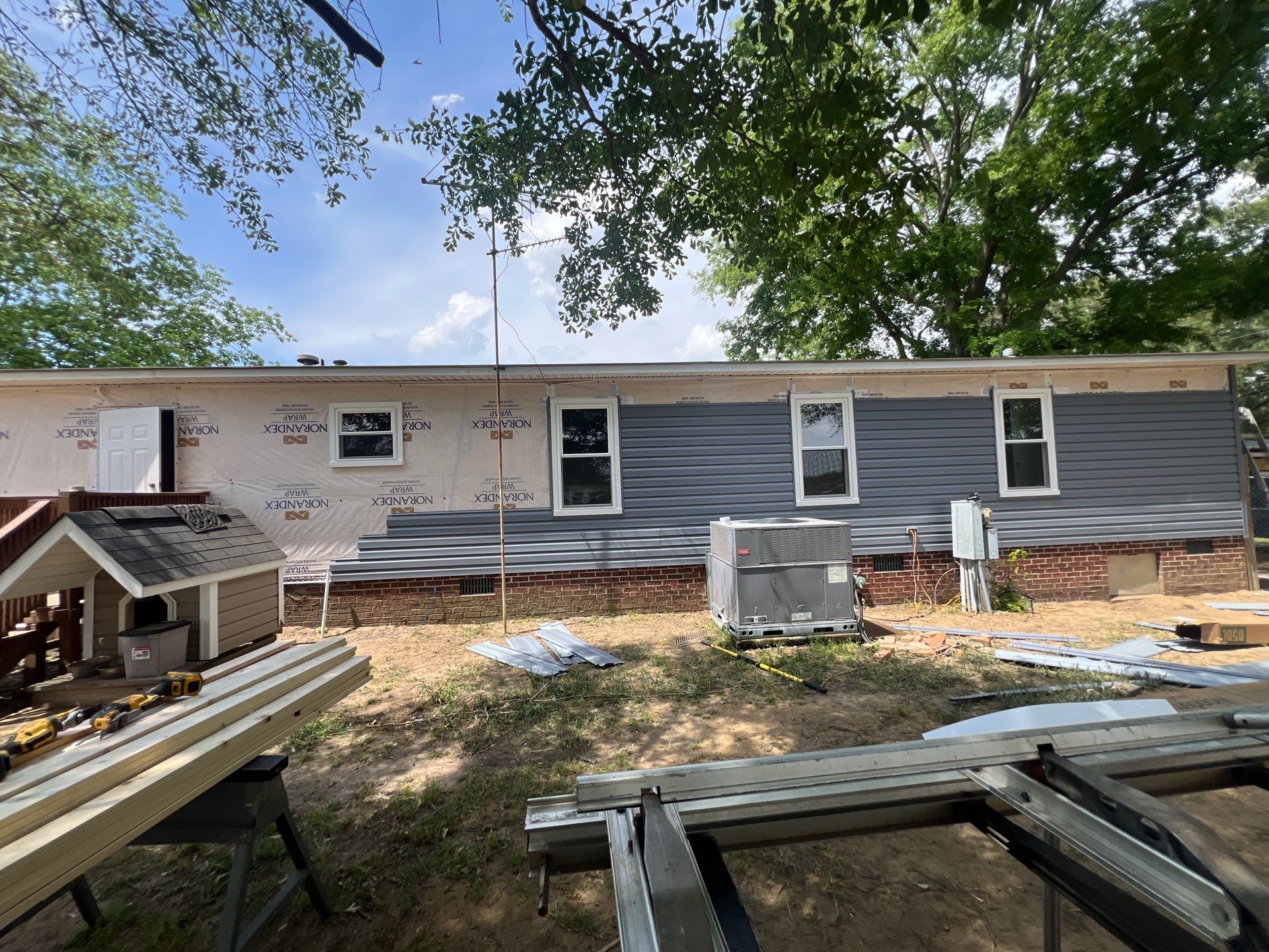 Vinyl Siding and Window Replacement for Goldsboro Modular Home by The Remodeling Company