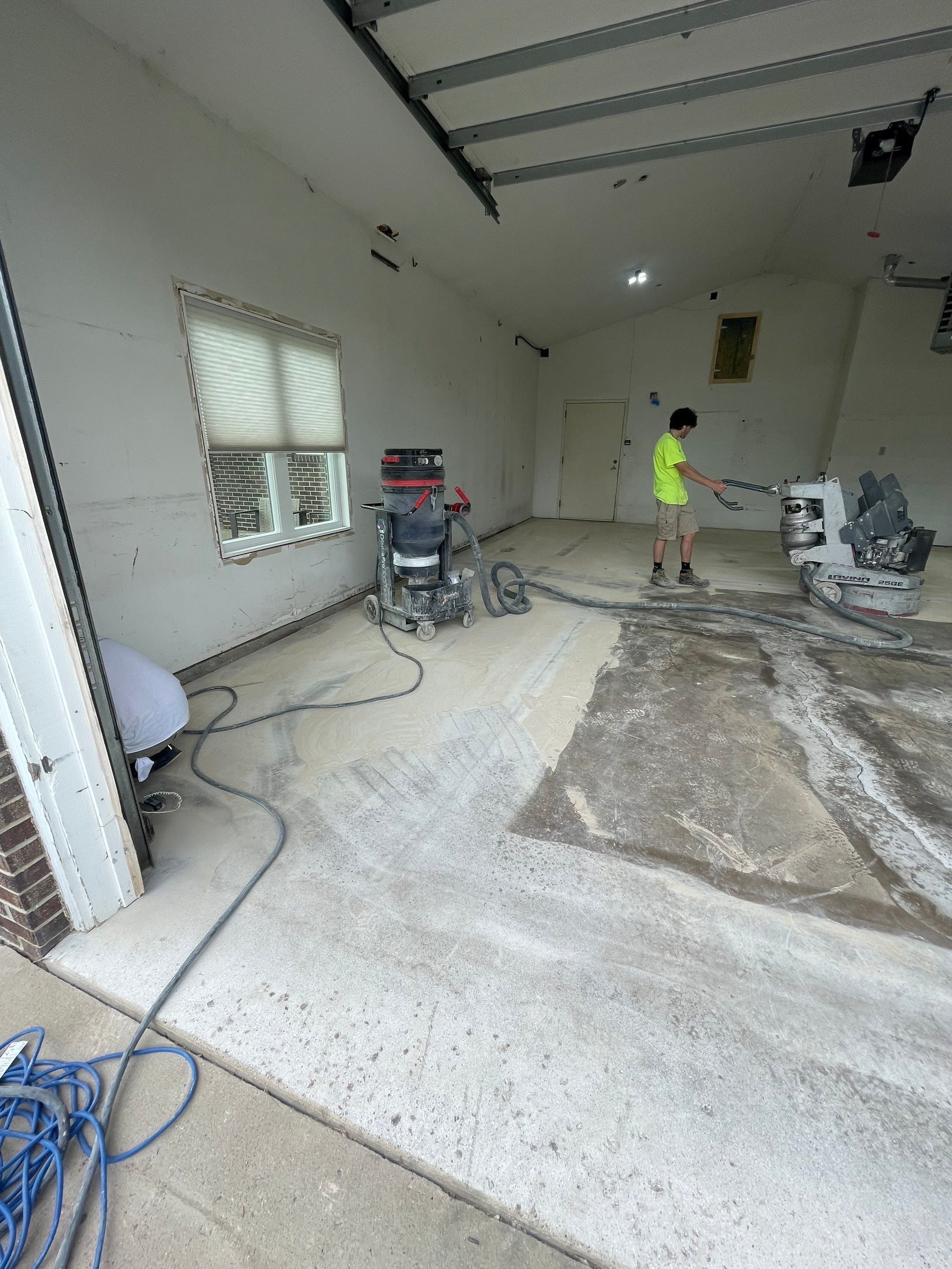 Coyote Flake Concrete Coating for Sioux Falls Garage by Select Painting, Coatings & Garage Cabinets