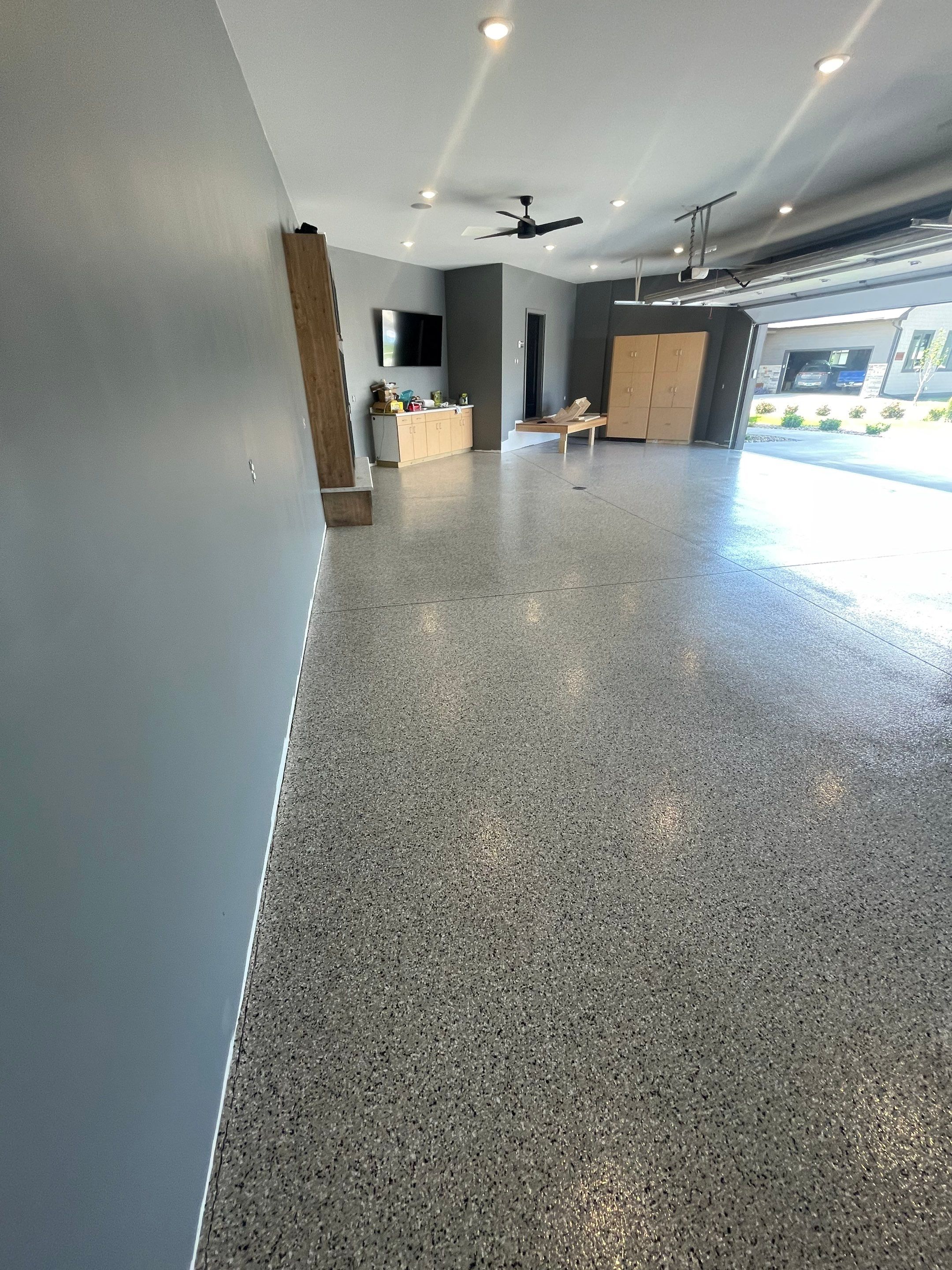 Custom Speckled Concrete Coating for Dell Rapids Garage by Select Painting, Coatings & Garage Cabinets