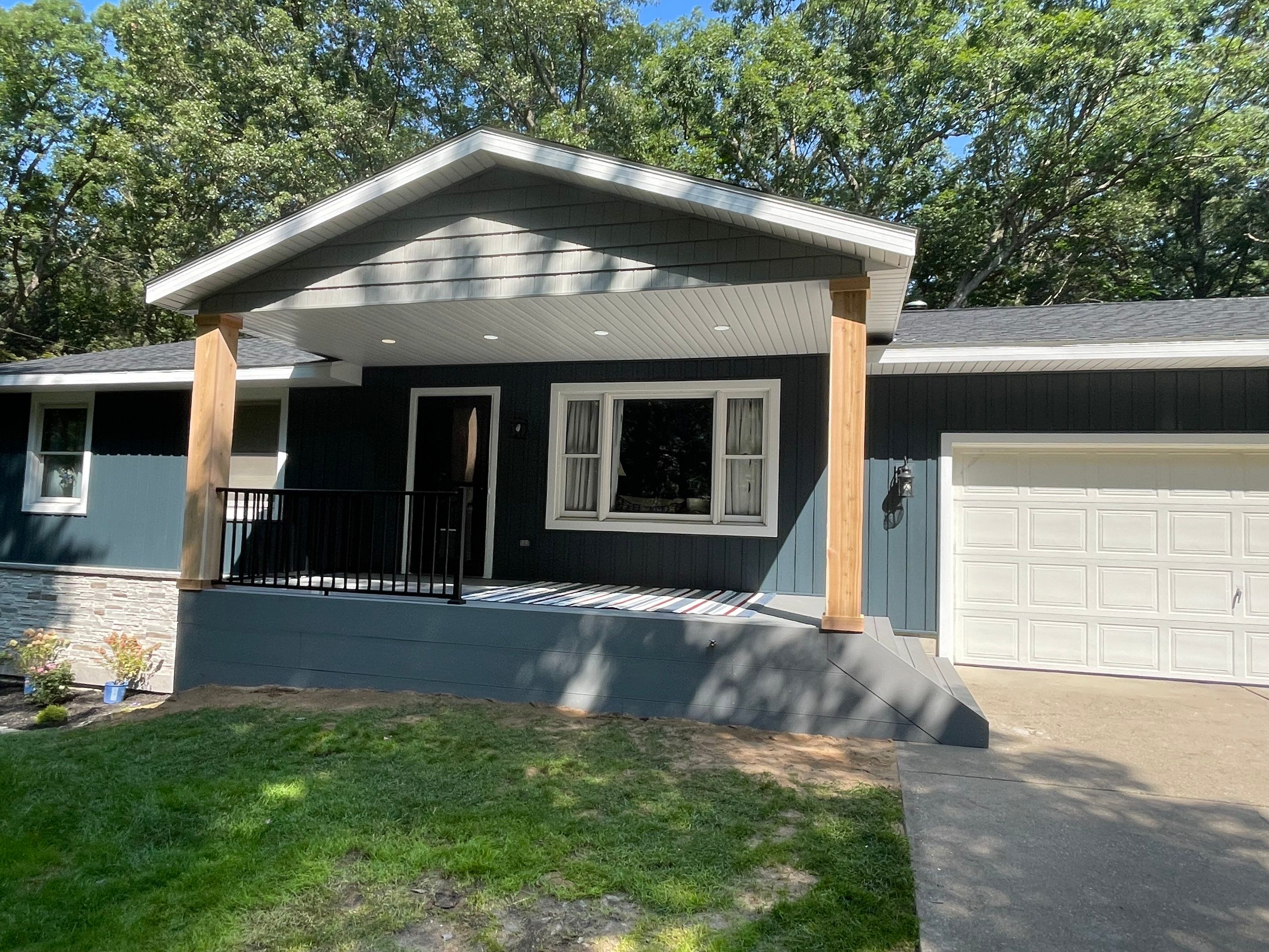 Siding, Deck and Versetta Stone by Avalon Roofing and Exteriors