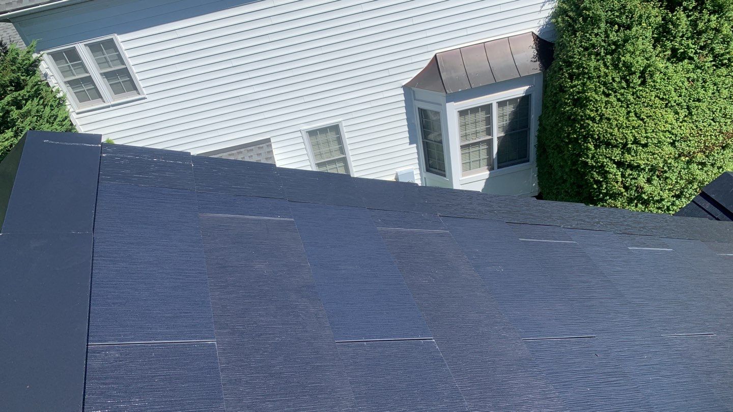 Tesla Solar Roof Replacement using Tesla Solar Roof V3 tiles by American Home Contractors