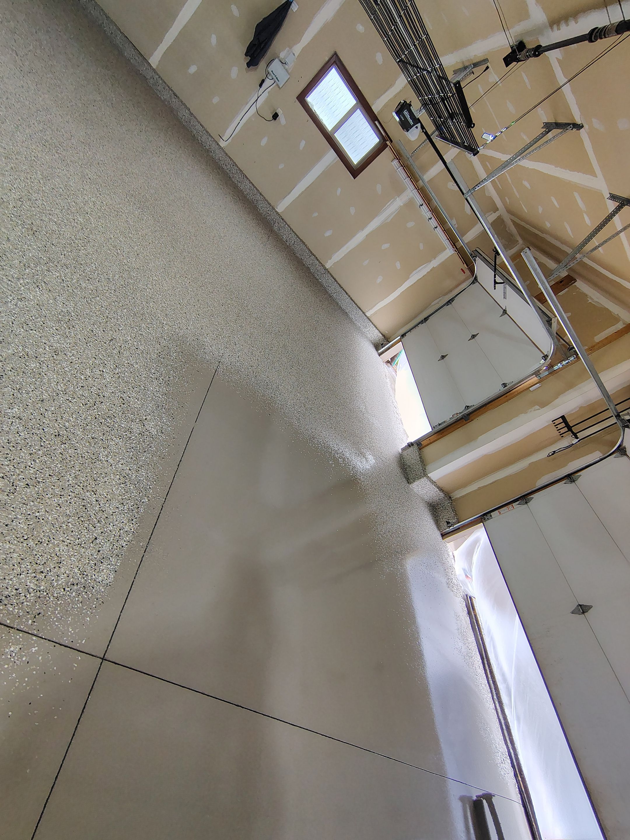 Multi-Car Garage Concrete Coating and Epoxy Finish in Sioux Falls by Select Painting, Coatings & Garage Cabinets