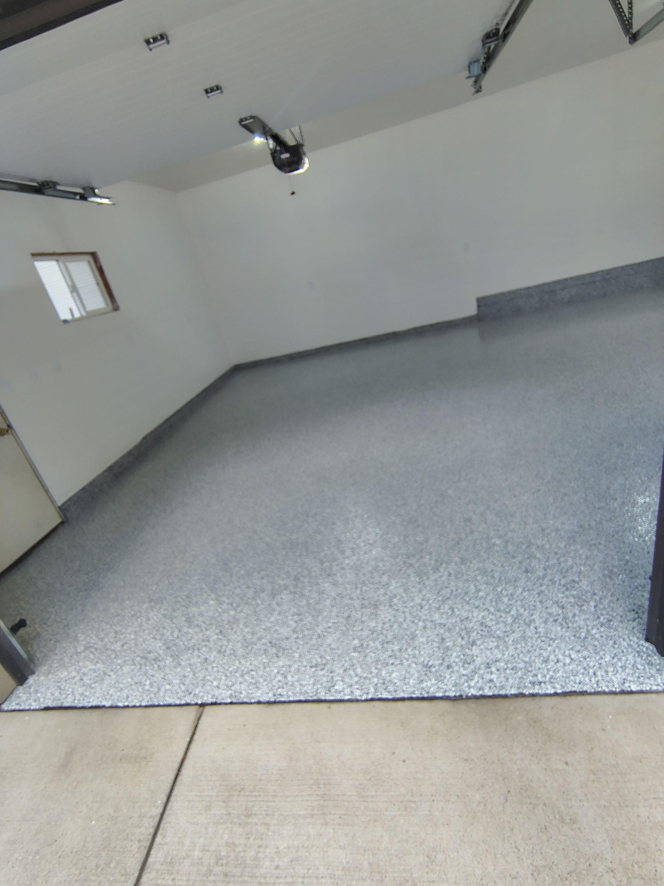 Epoxy Concrete Coating and Garage Floor Restoration in Sioux Falls by Select Painting, Coatings & Garage Cabinets