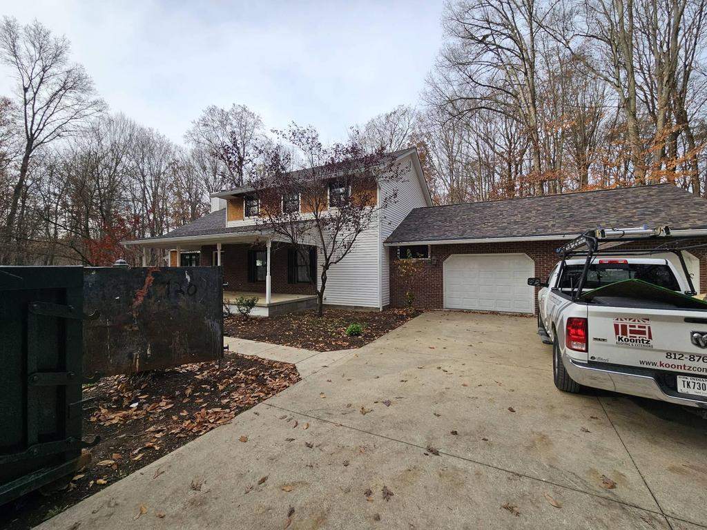 Siding Installation using Primed James Hardie & Straight Edge Shakes by Koontz Construction