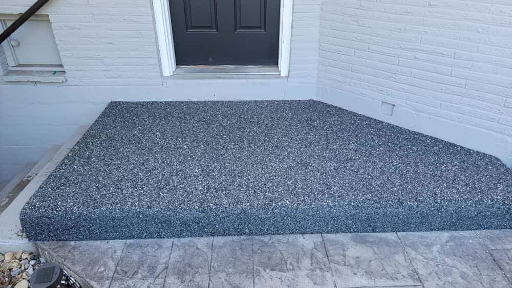 Charming Compact Patio in Vuba Stone by Concrete Coating Experts Inc.