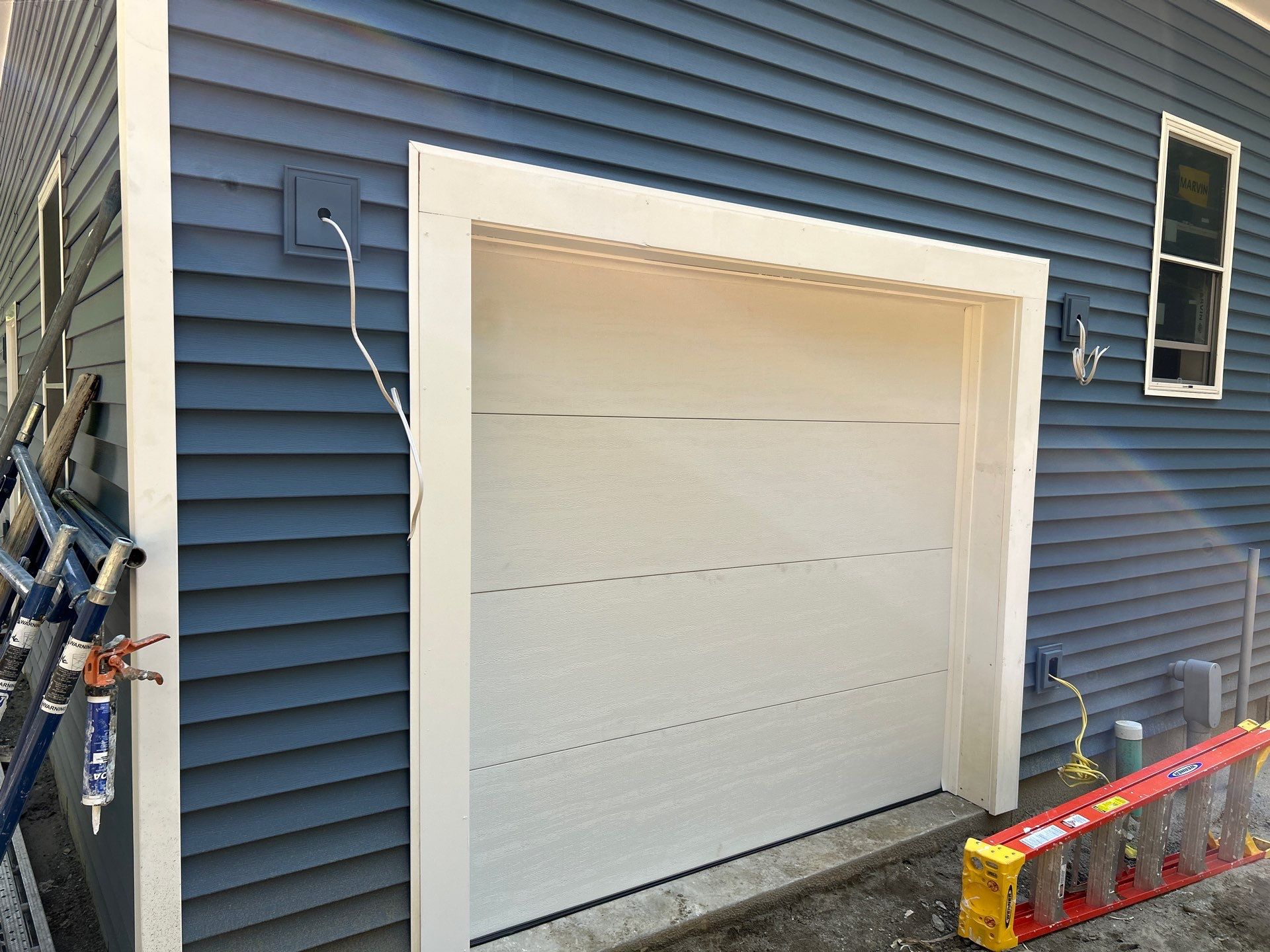 Installation of a Clopay Modern Steel Garage doors by Keene Door