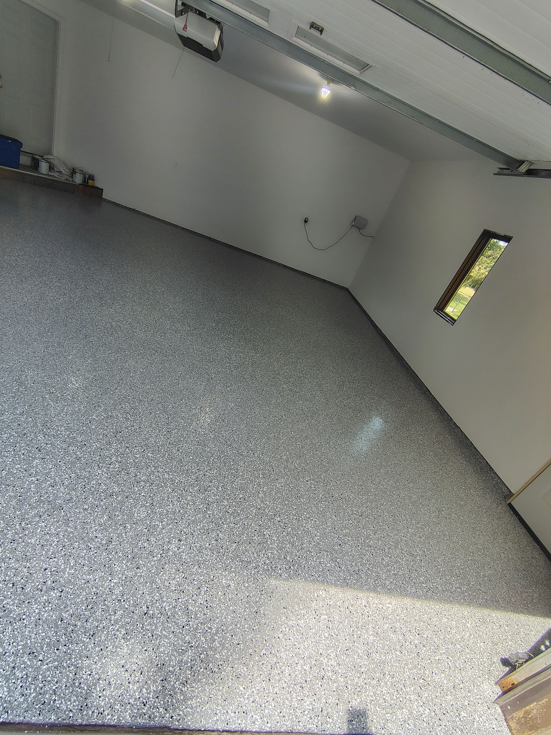 Sioux Falls Garage Floor Coating with Speckled Flake Finish by Select Painting, Coatings & Garage Cabinets