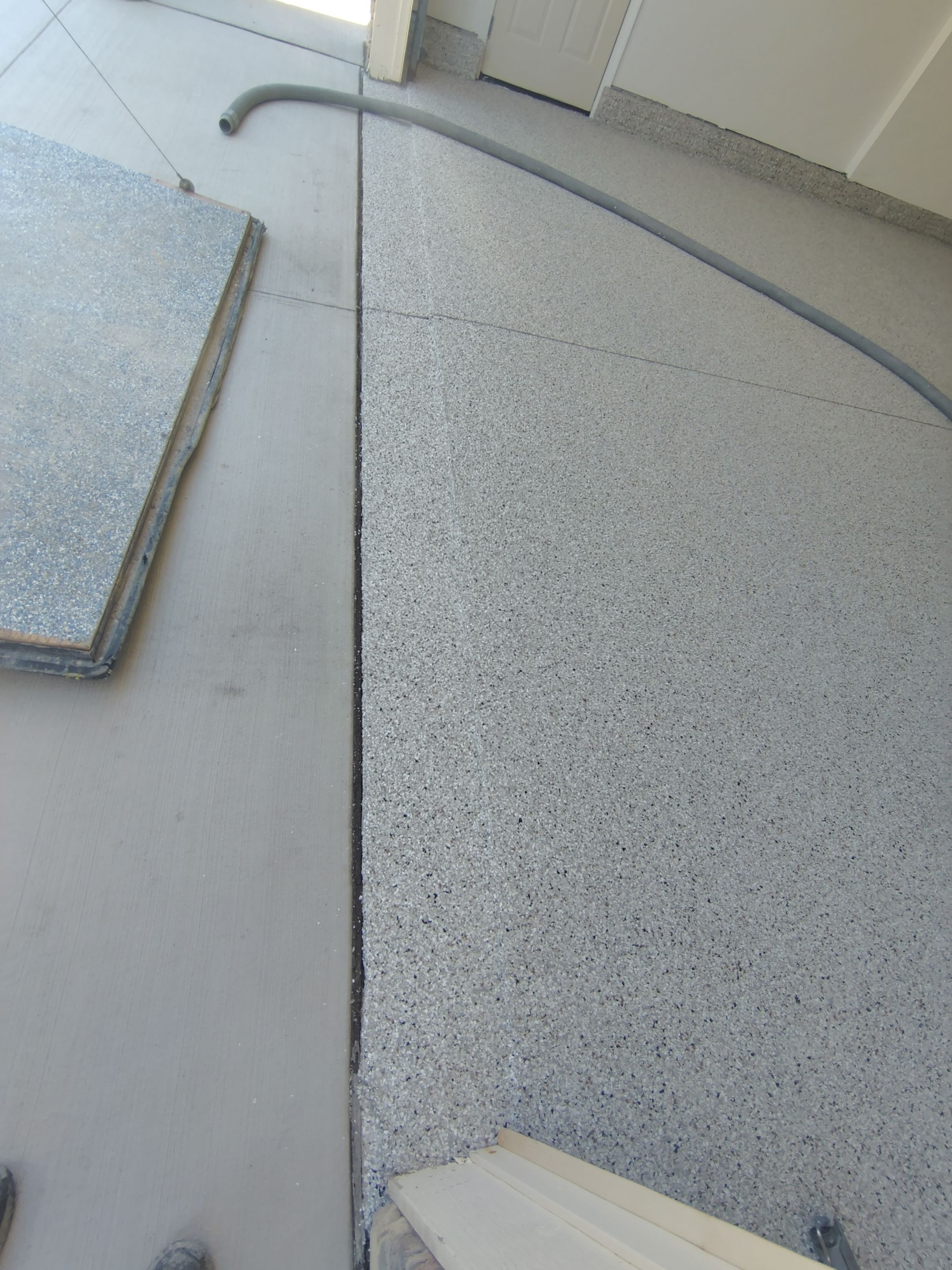 Custom Grey Speckled Epoxy Floor Coating for Sioux Falls Garage by Select Painting, Coatings & Garage Cabinets