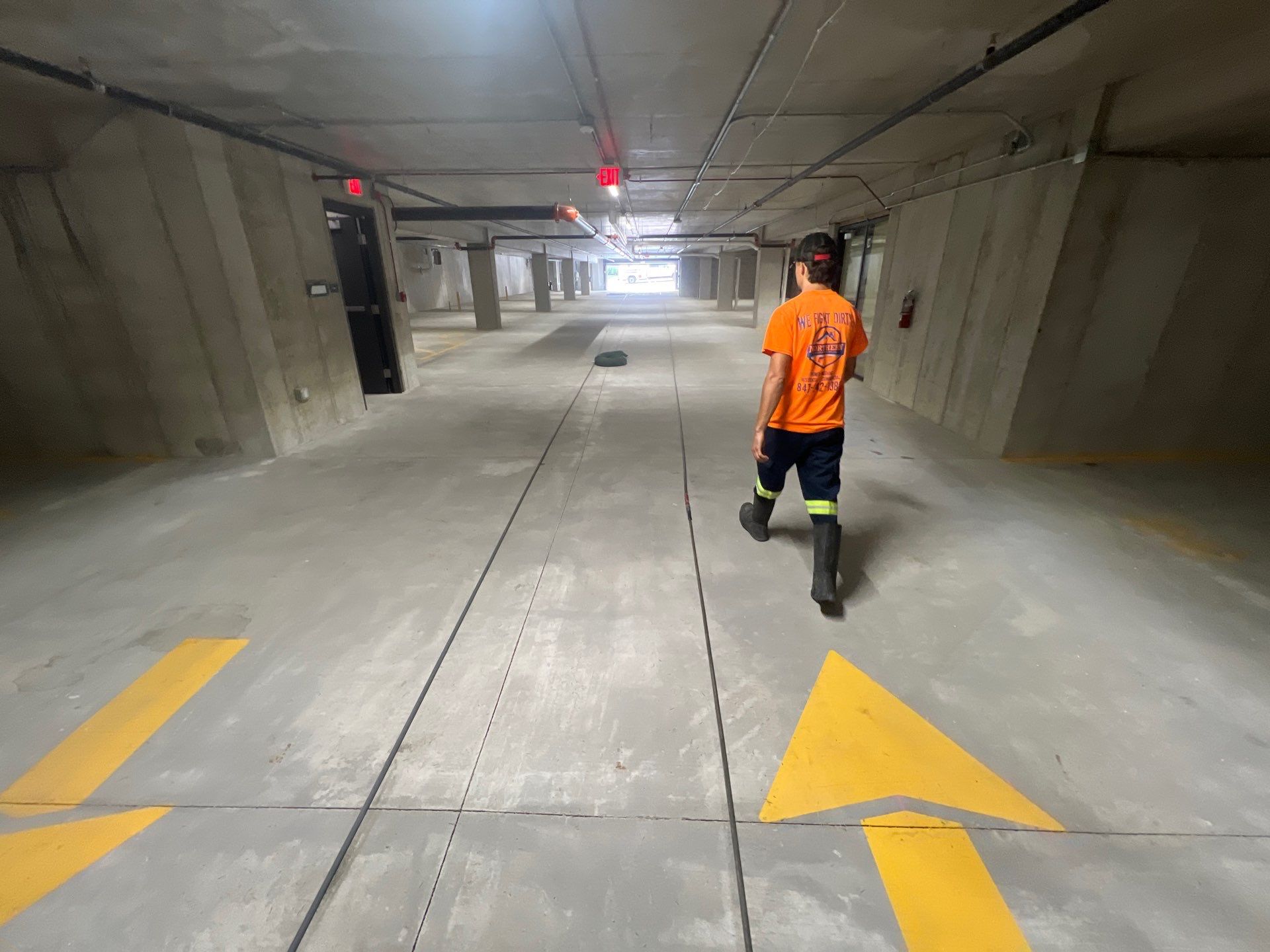 Parking garage using Hot water by Northern Power Washing LLC.