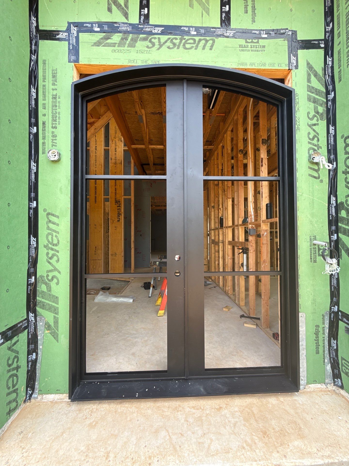 Custom Arched Entry Door Installation and Finishing in Southlake by Solara Custom Living