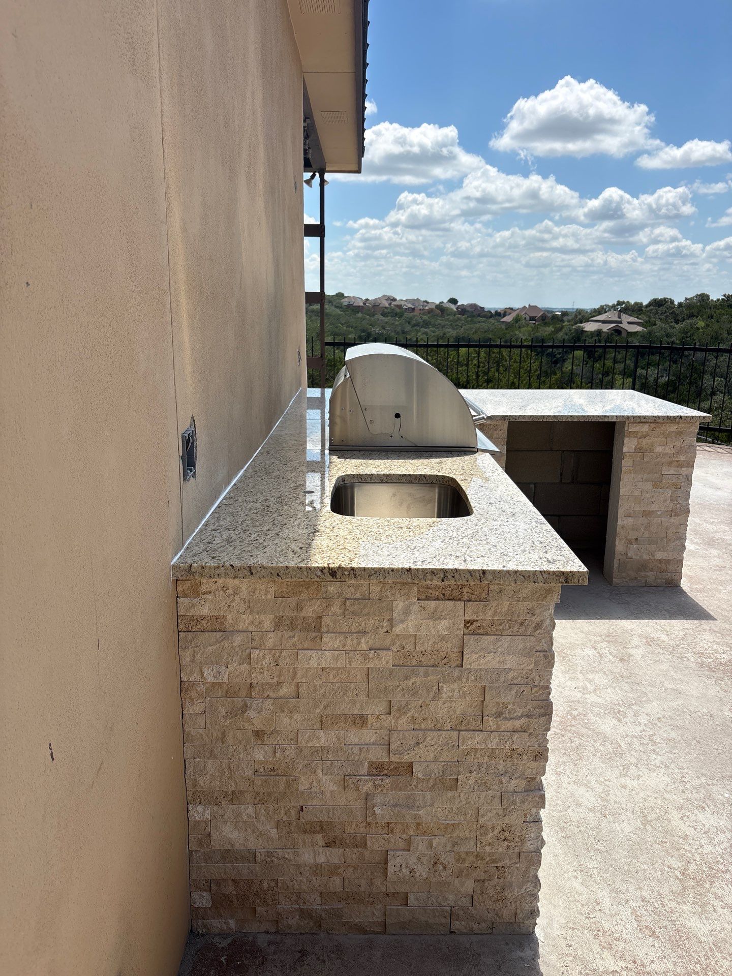 Custom Outdoor Kitchen and Stacked Stone Island in Helotes by Mena stone surfaces
