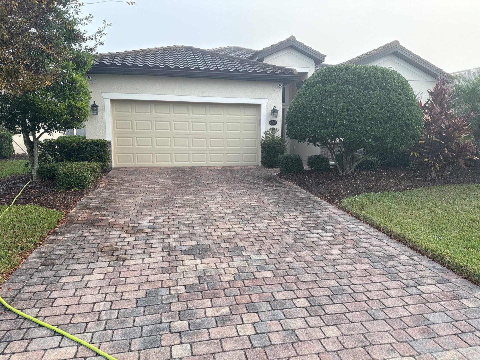 Barrel Tile Roof Cleaning & Paver Driveway Cleaning in River Strand at Heritage Harbour | Bradenton, FL by Sunshine AquaWash