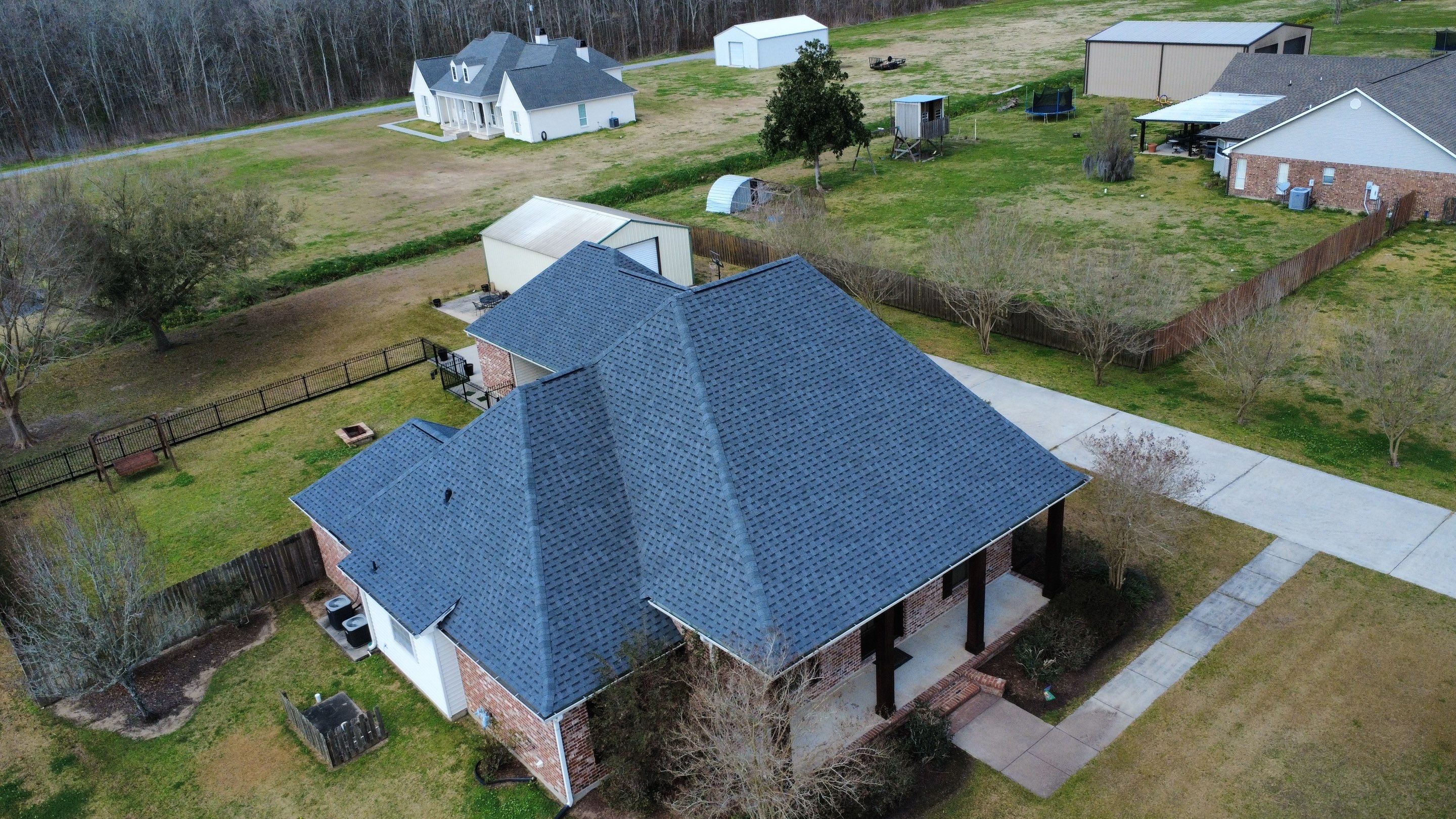 Residential roof installation in Plaquemine, LA using Atlas Pinnacle Pristine Pewter shingles  by Top Team Roofing & Construction