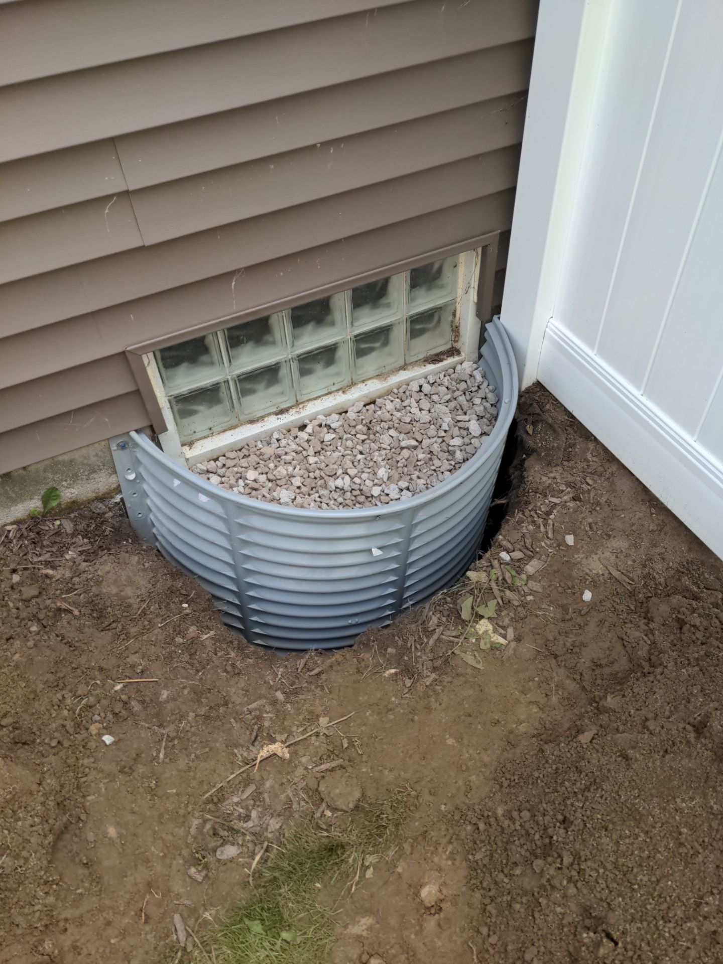 Interior Basement Waterproofing System and Egress Window Installation by Toledo Basement Repair 