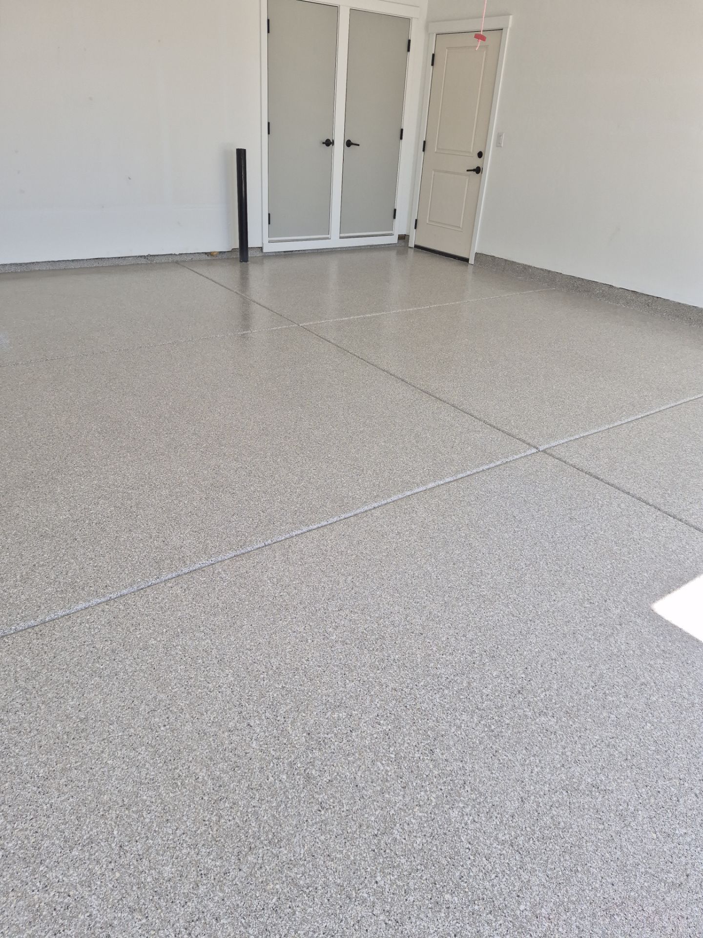 Limestone Hybrid Garage Floor Transformation in Coeur d'Alene by Croc Coatings, LLC